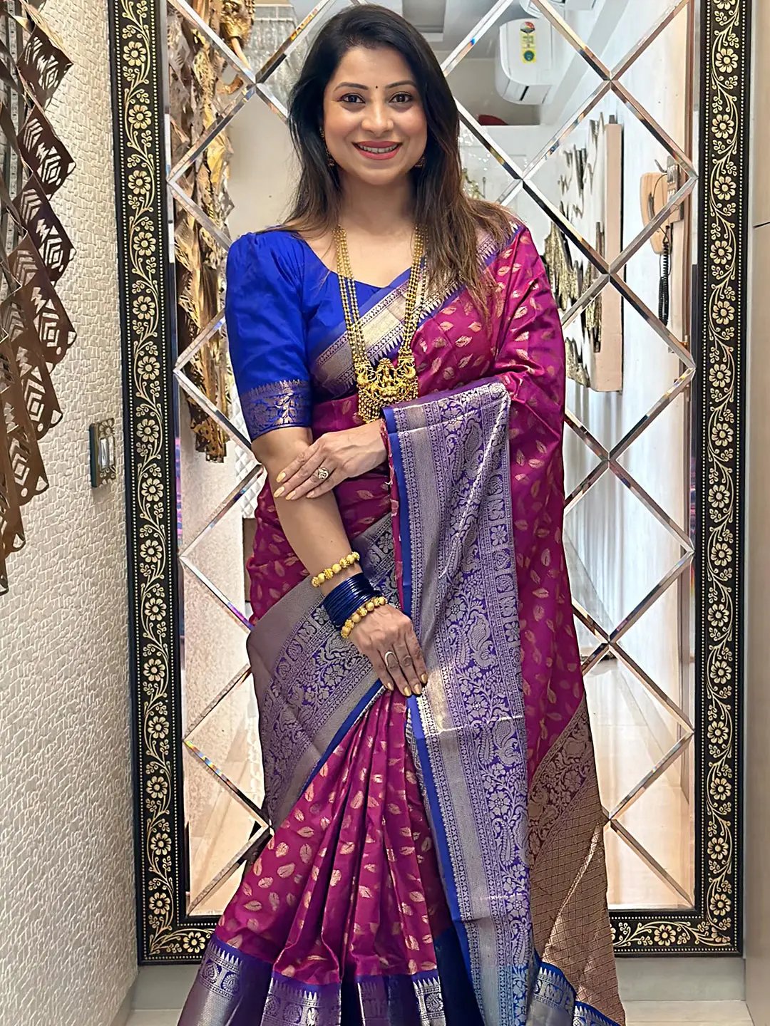 Traditional Wine Banarasi Kanchi Pattu Saree display