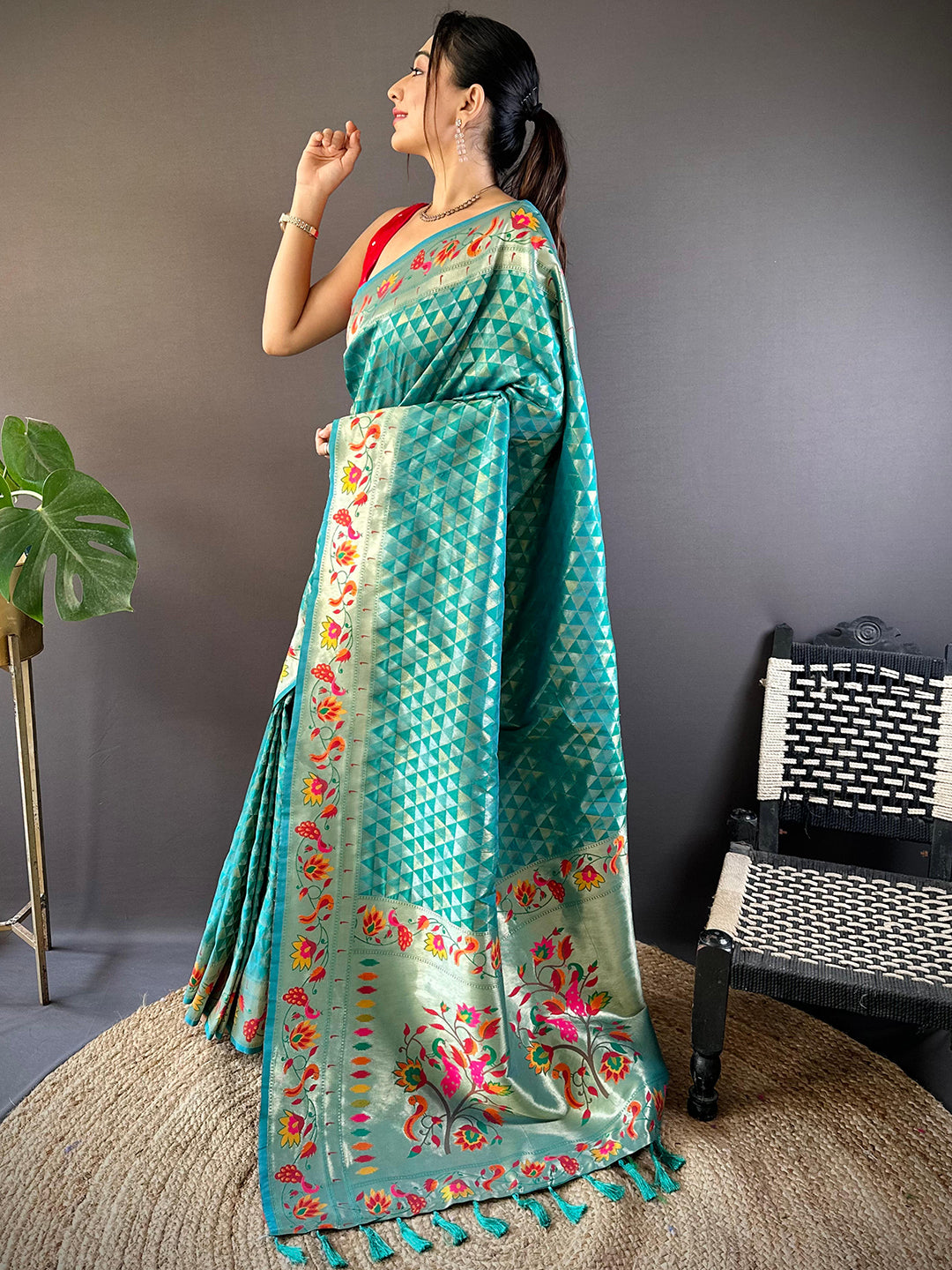 Model wearing Rama silk Paithani saree with vibrant zari work