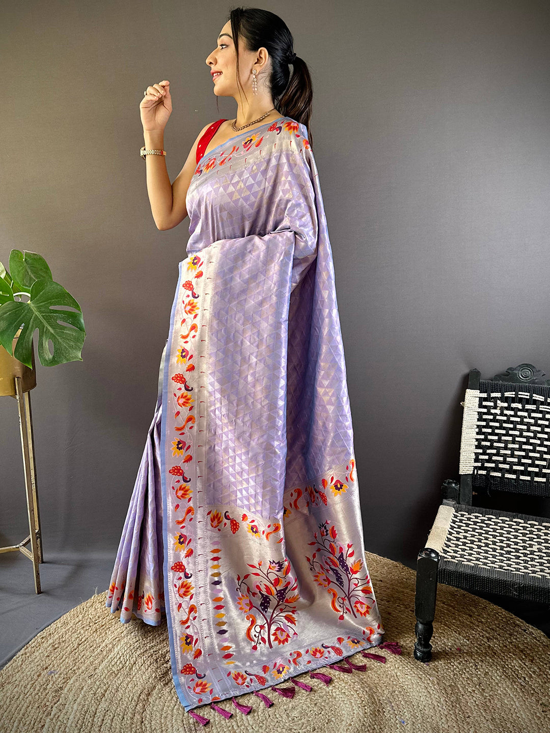 Traditional lavender silk saree featuring woven zari work