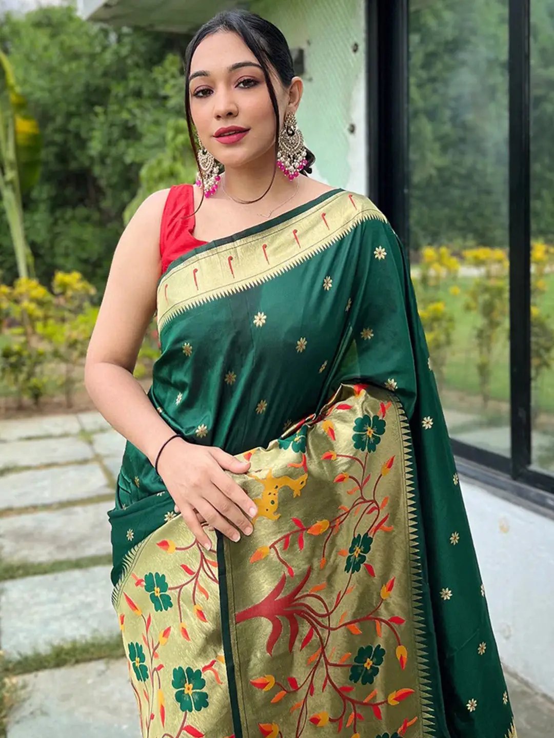 Elegant dark green Paithani saree featuring intricate woven border