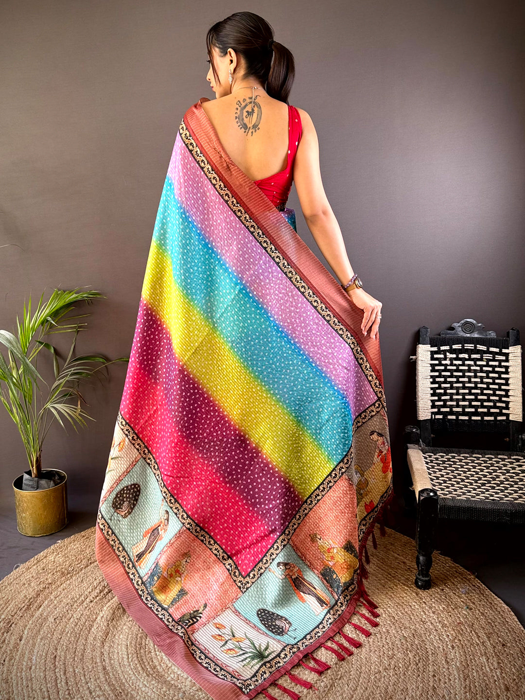 Back view of Radiance Silk Blend Bandhani Print Saree showcasing colorful gradient patterns and artistic motifs. A stunning pick for traditional events.