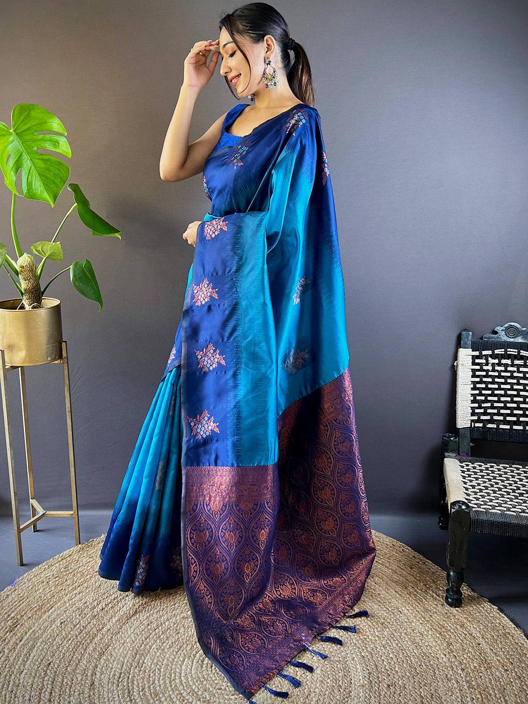 Model wearing Royal Blue Sami Banarasi Tussar Silk Saree with floral motifs