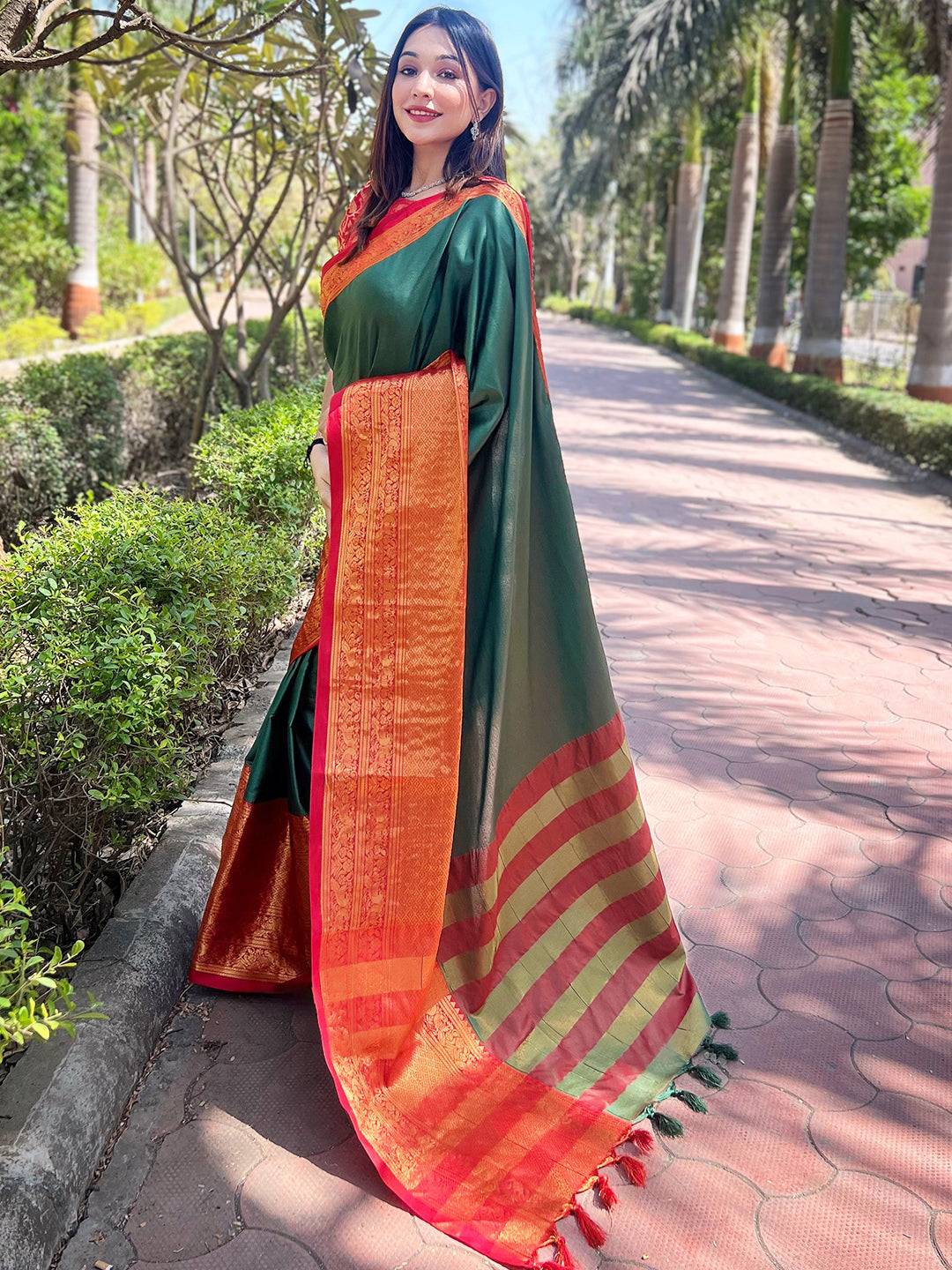 Elegant bottle green Kanjivaram saree with orange pallu