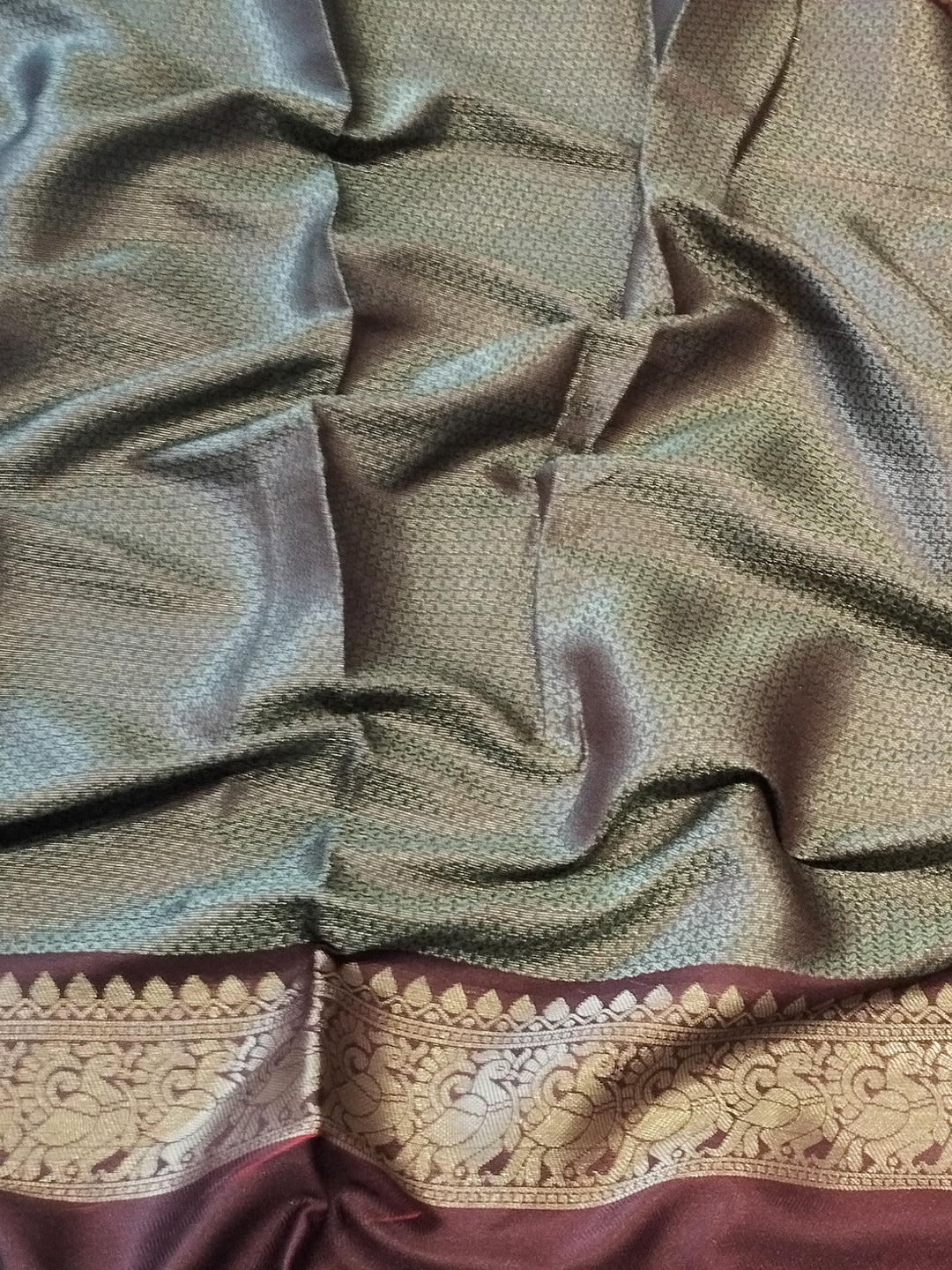 Detailed view of Banarasi silk saree fabric with border