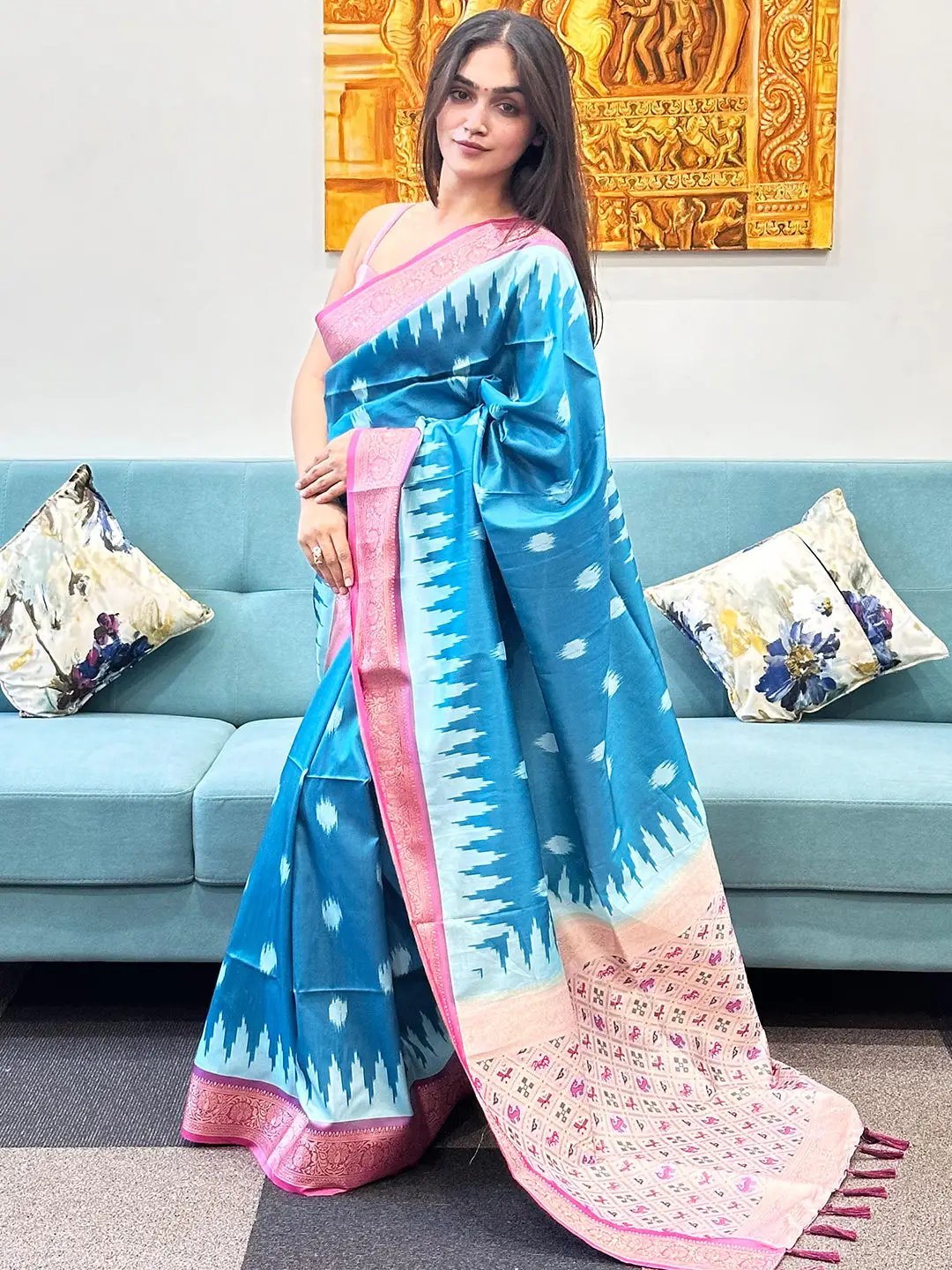 Traditional blue Banarasi saree with intricate zari patola pallu.