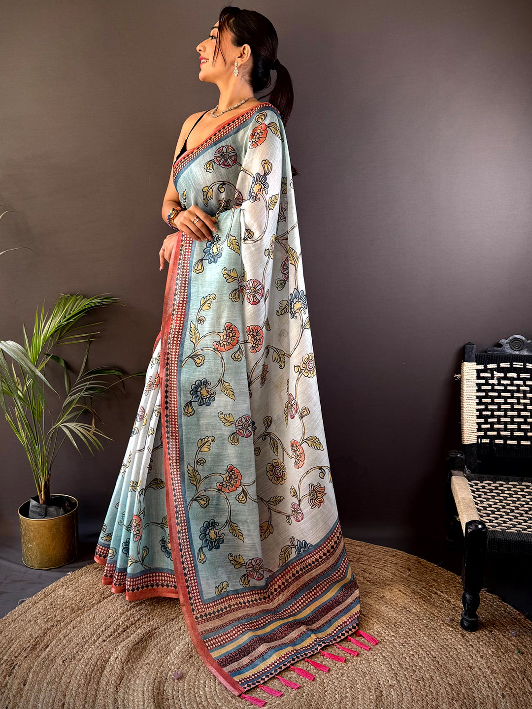 Elegant Sky Blue Zari Tussar Floral Saree draped gracefully, highlighting its luxurious fabric and intricate floral design for special occasions.