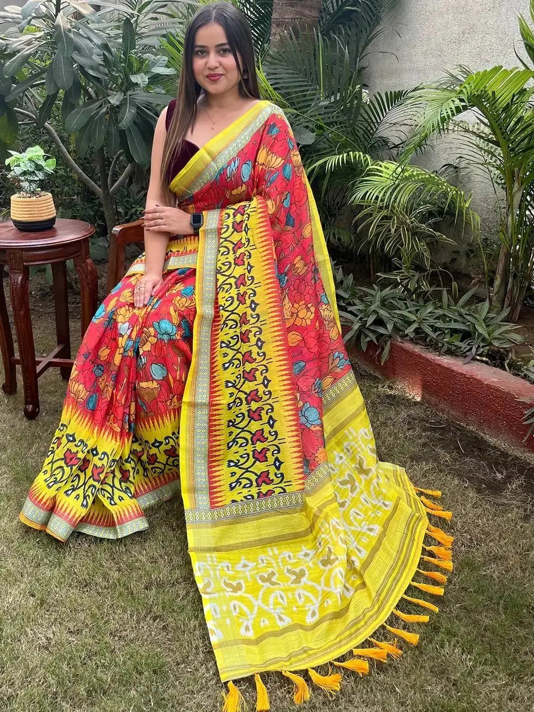 Vibrant floral Ikkat printed saree with yellow and red hues