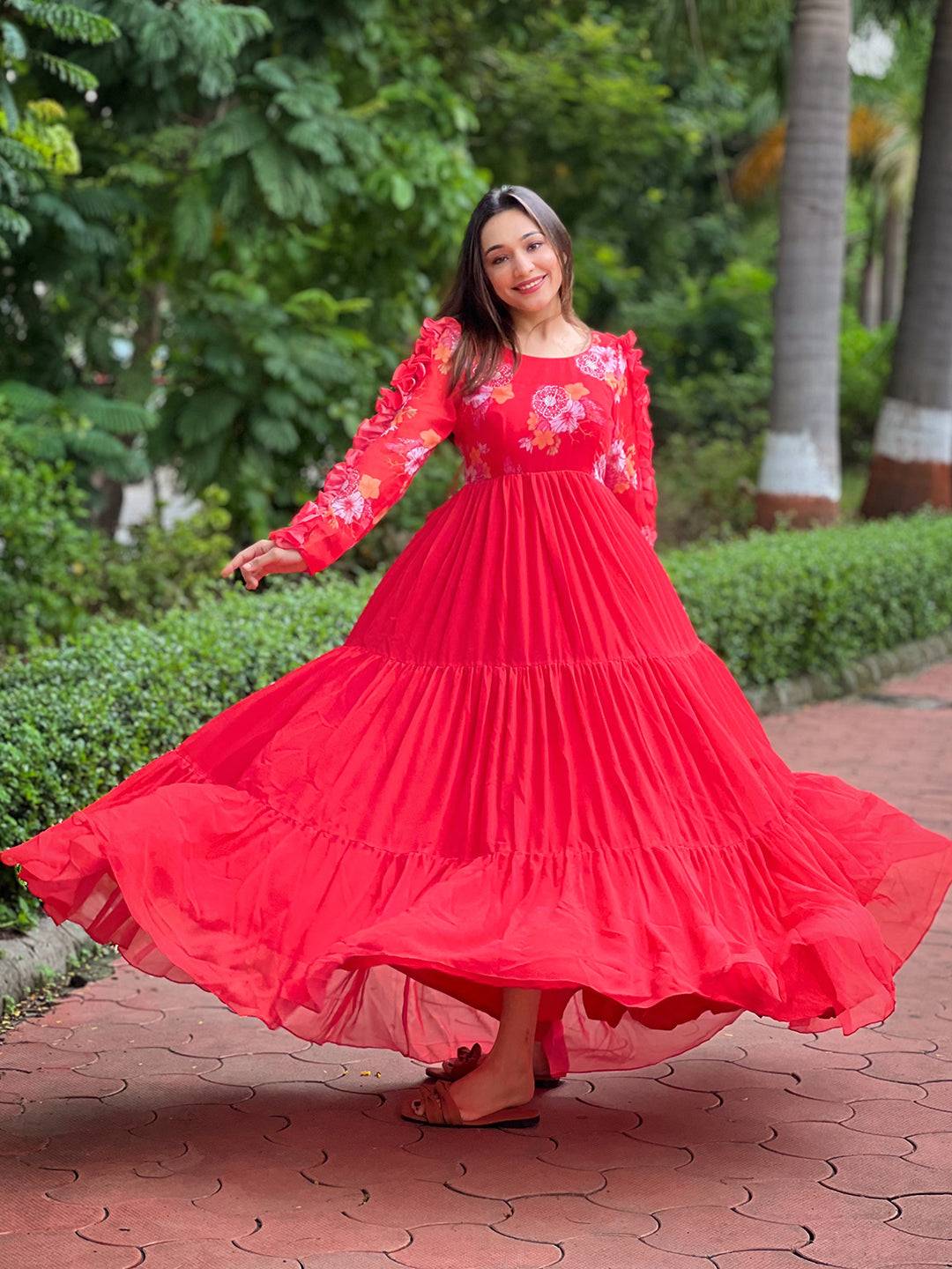 Model twirling in Radiant Ruby Dress with floral details