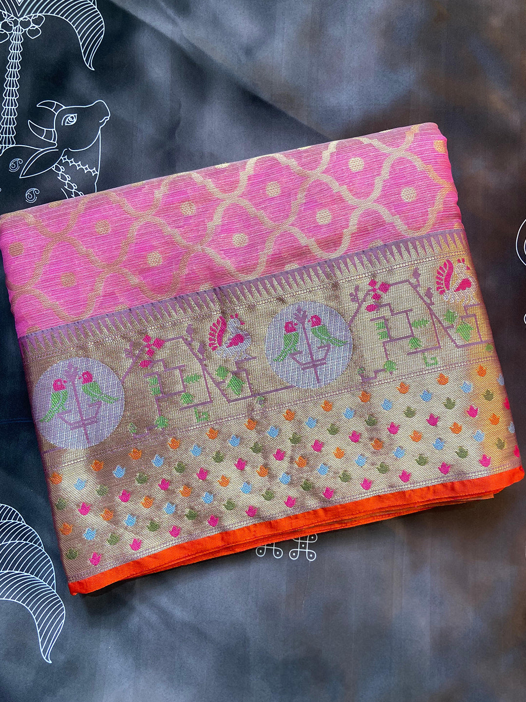 Folded pink Kota Doria silk saree with Minakari Patola design