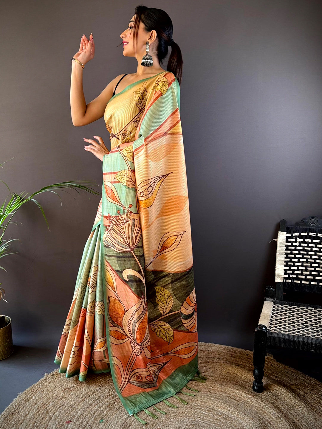 Model wearing Jade Green Zari Tussar Saree with floral pattern