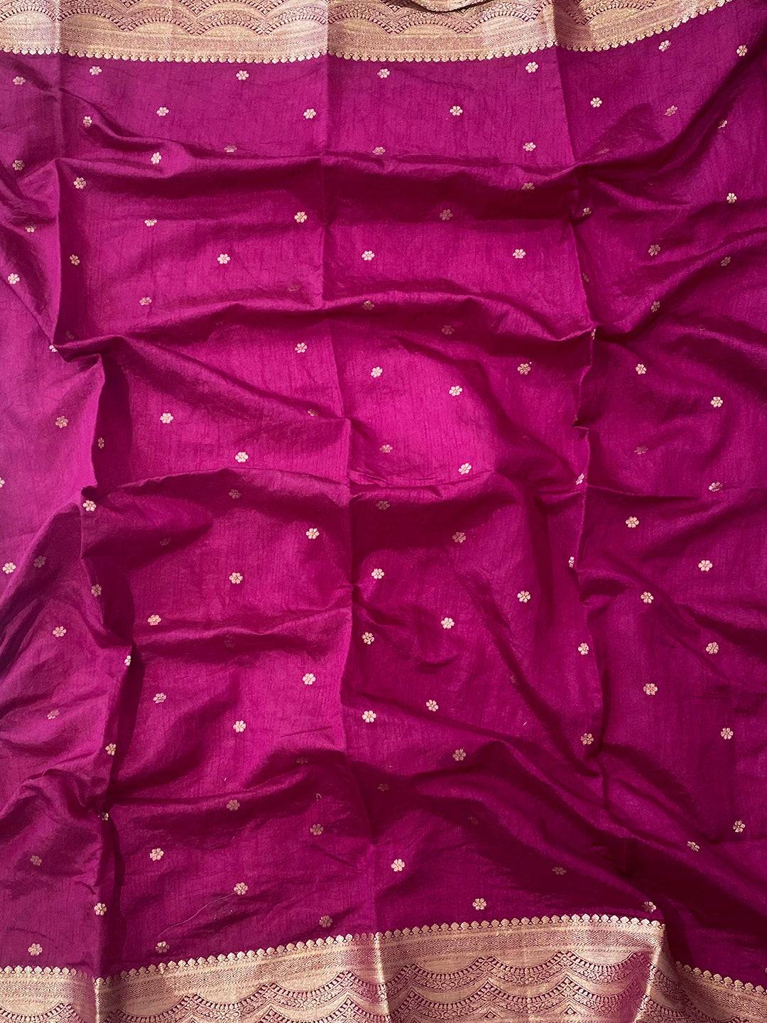 Close-up of maroon blouse with gold embroidery details