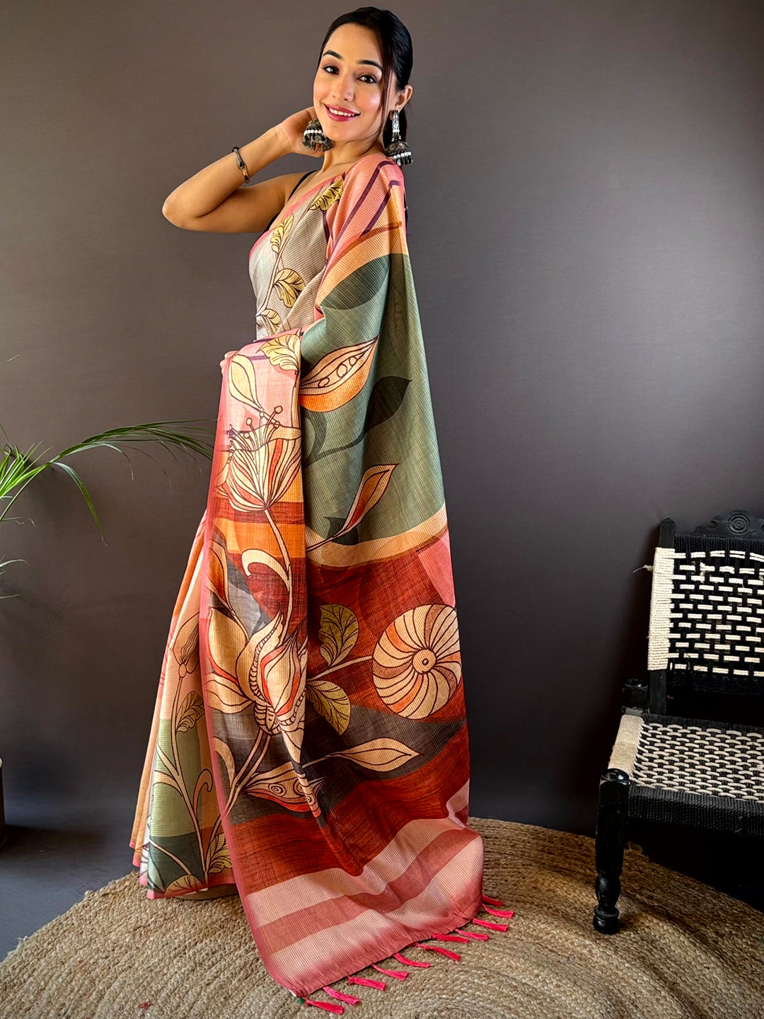 Model wearing Rose Pink Zari Tussar Saree with floral pattern