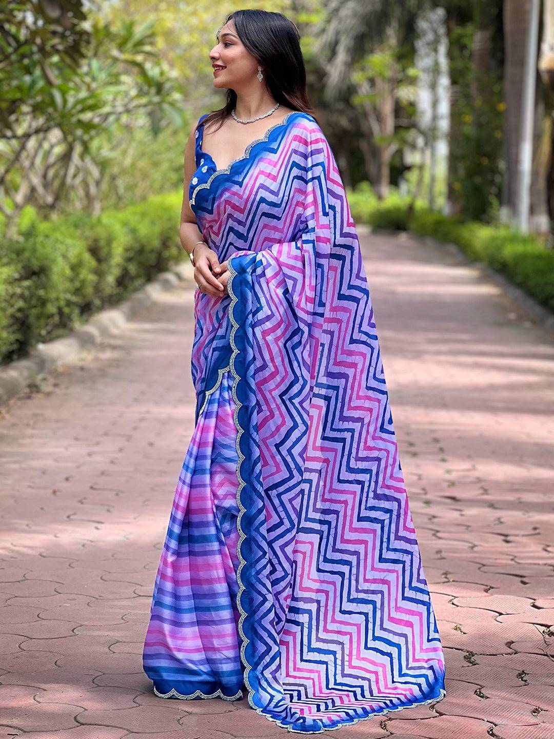 Elegant Leheriya and striped print saree with blue accents