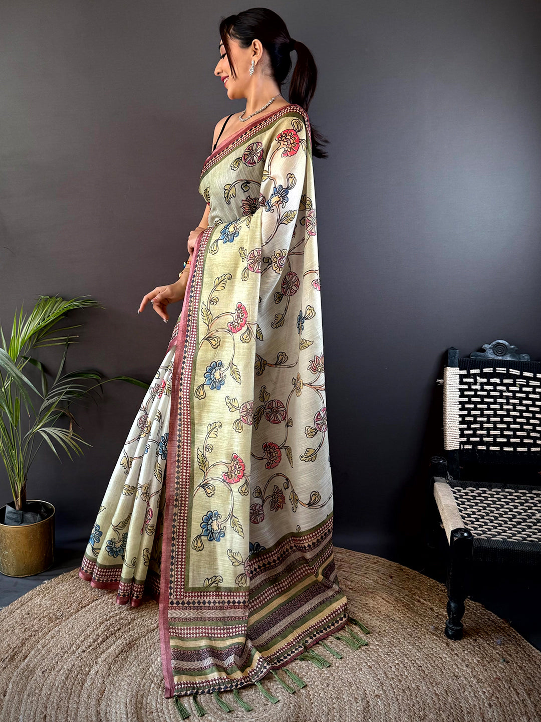 Graceful Swamp Green Zari Tussar Floral Saree with delicate floral prints and zari accents, styled for a timeless ethnic appeal.