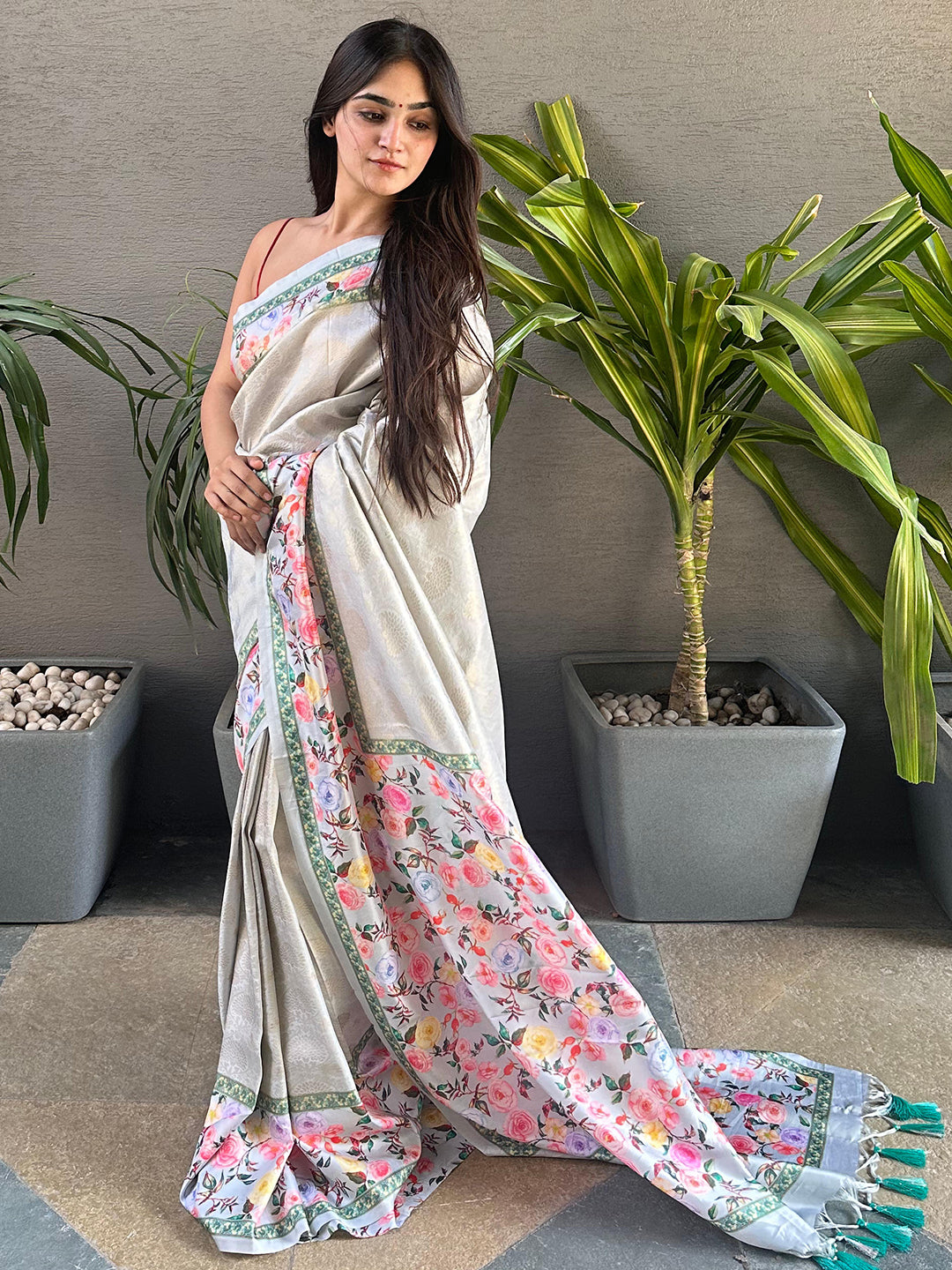 Model showcasing a floral print Kanjivaram saree.