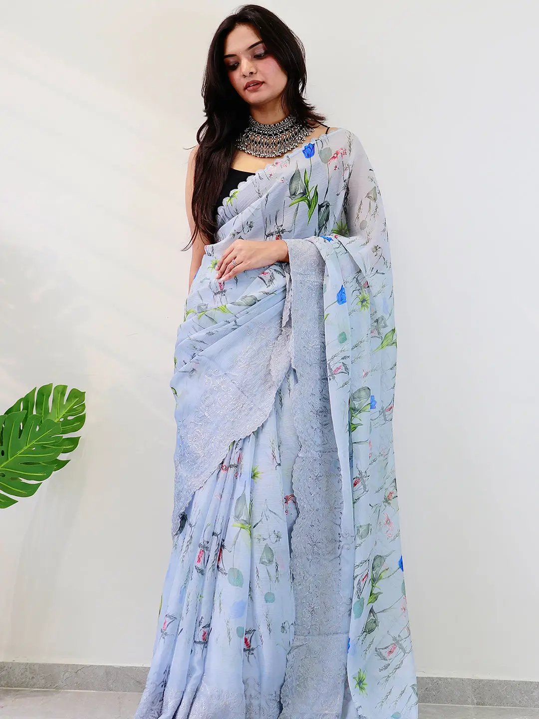 Chiffon satin saree featuring floral design and lace border