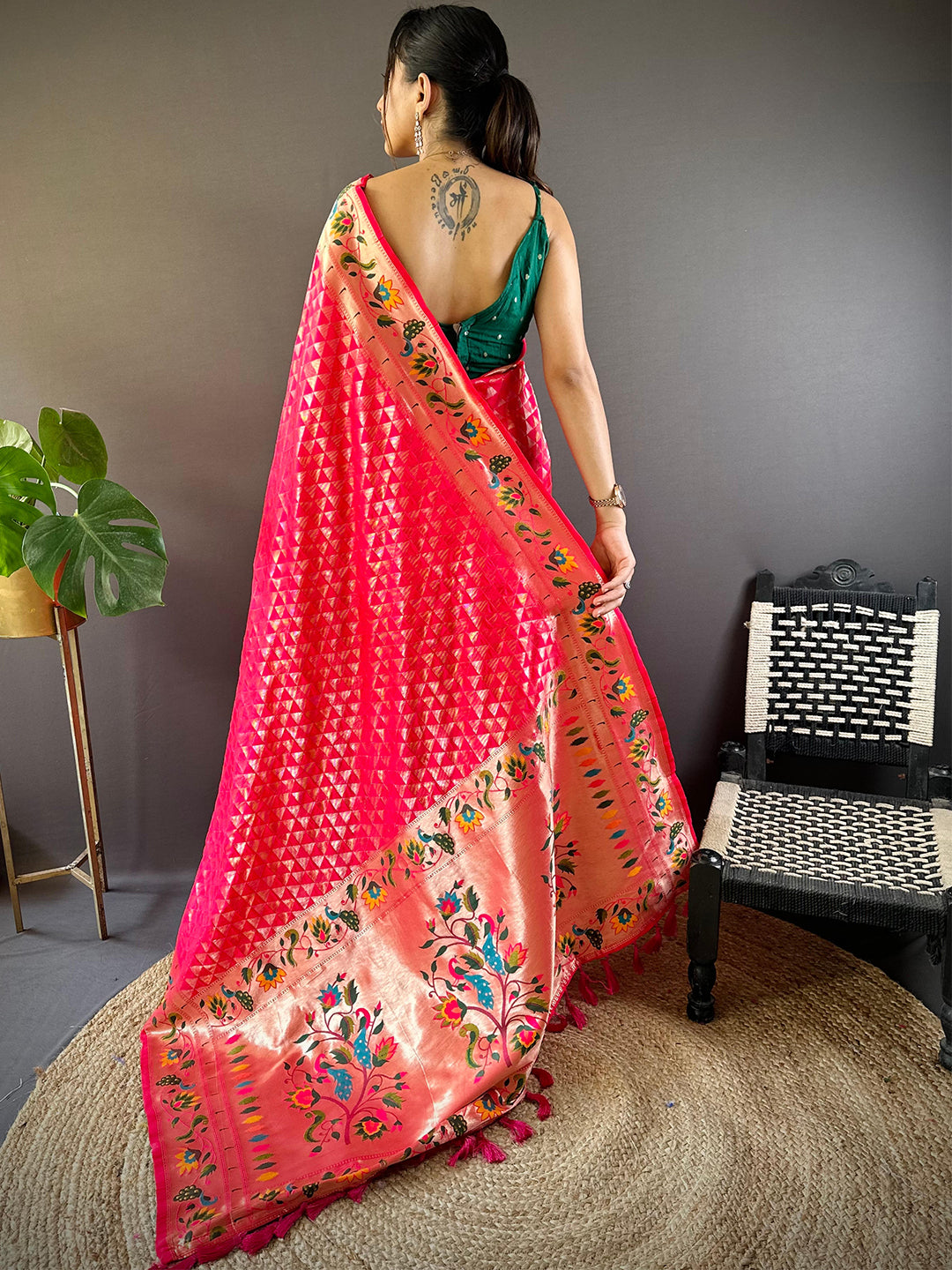 Back view of pink silk blend Paithani saree with floral patterns