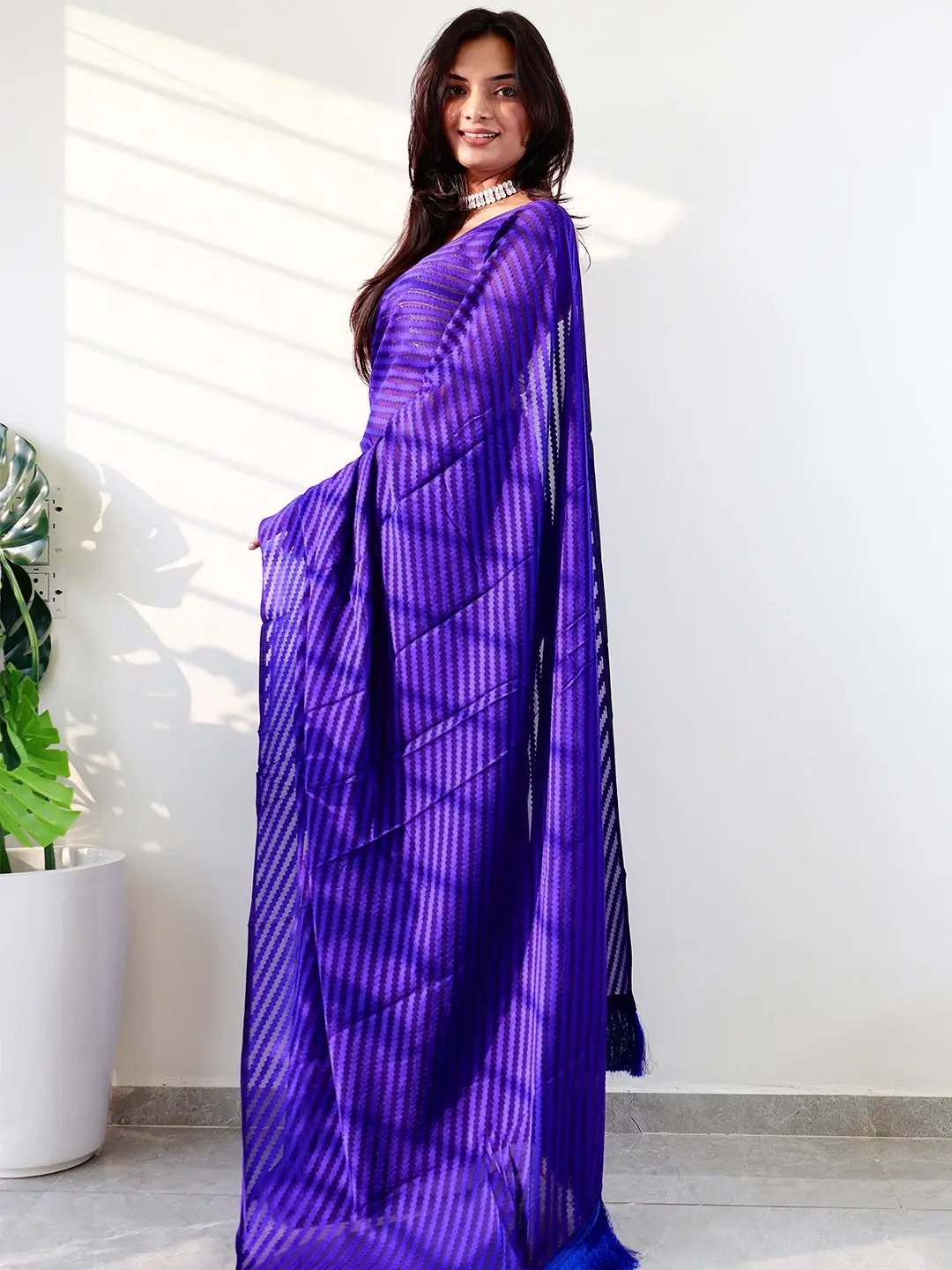 Elegant blue georgette saree with intricate thread weaving