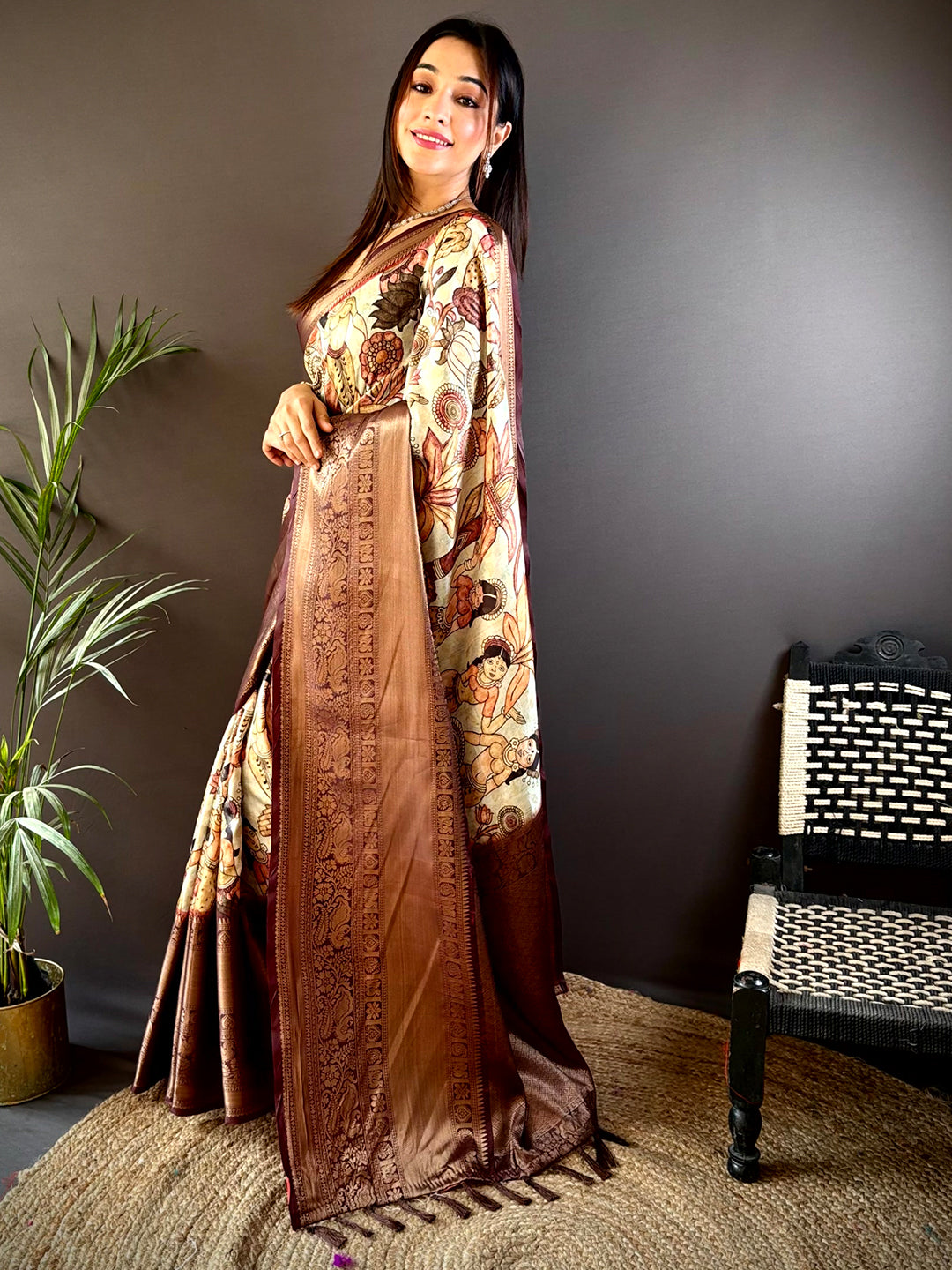 Traditional brown silk saree featuring pattu zari border