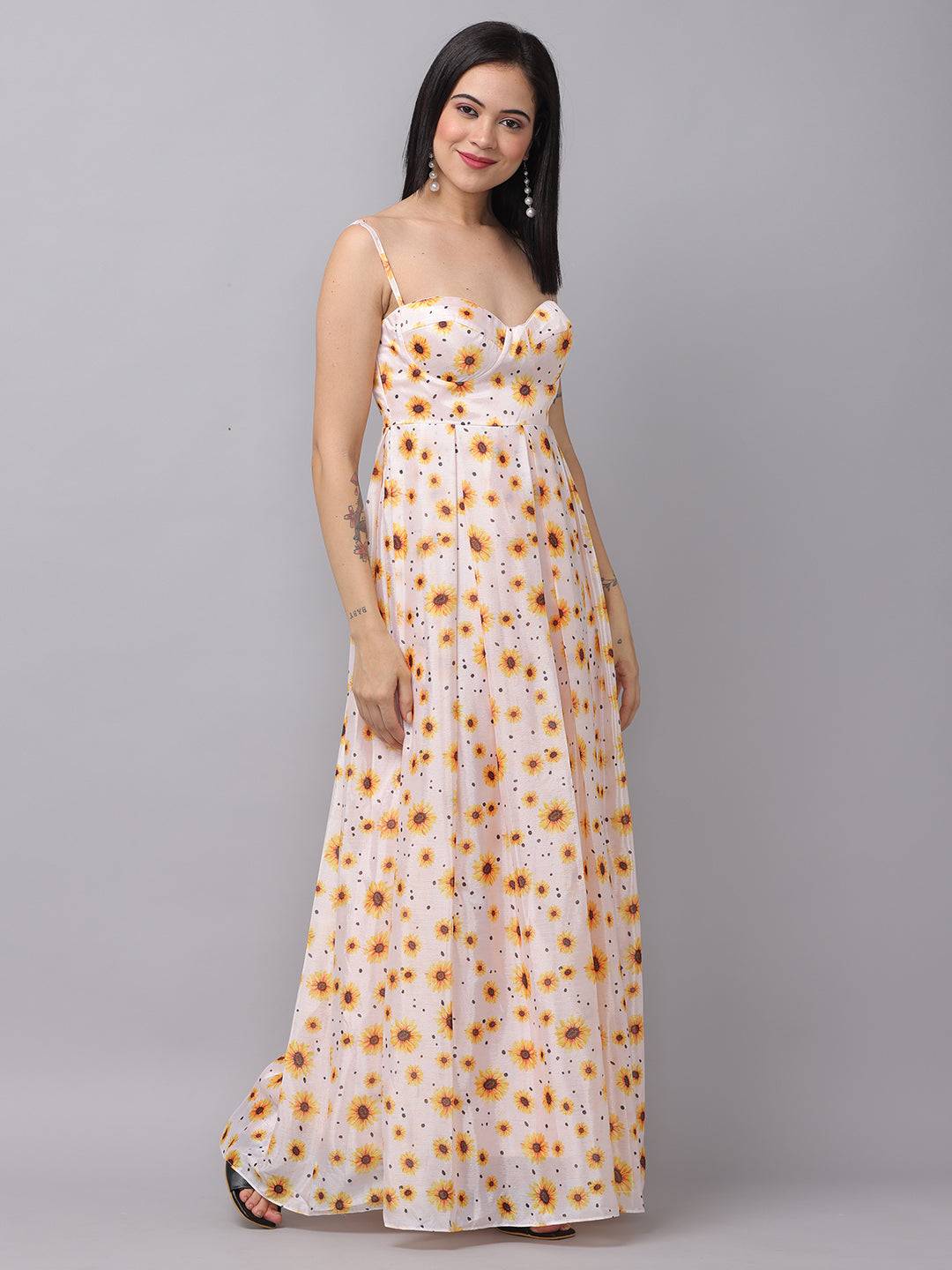 White sunflower printed dress with flowing maxi design.