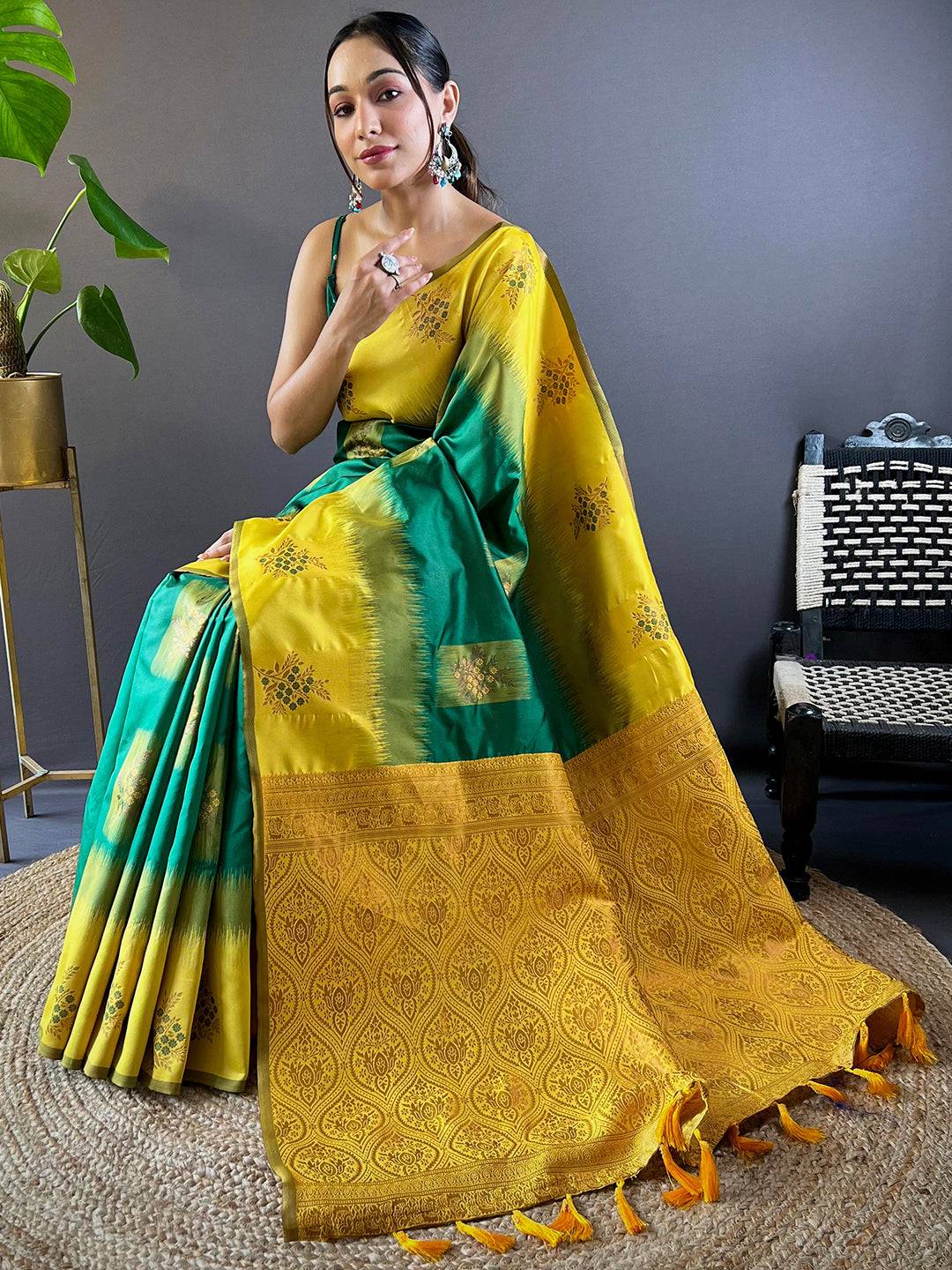 Seated model in dark green Sami Banarasi Tussar silk saree