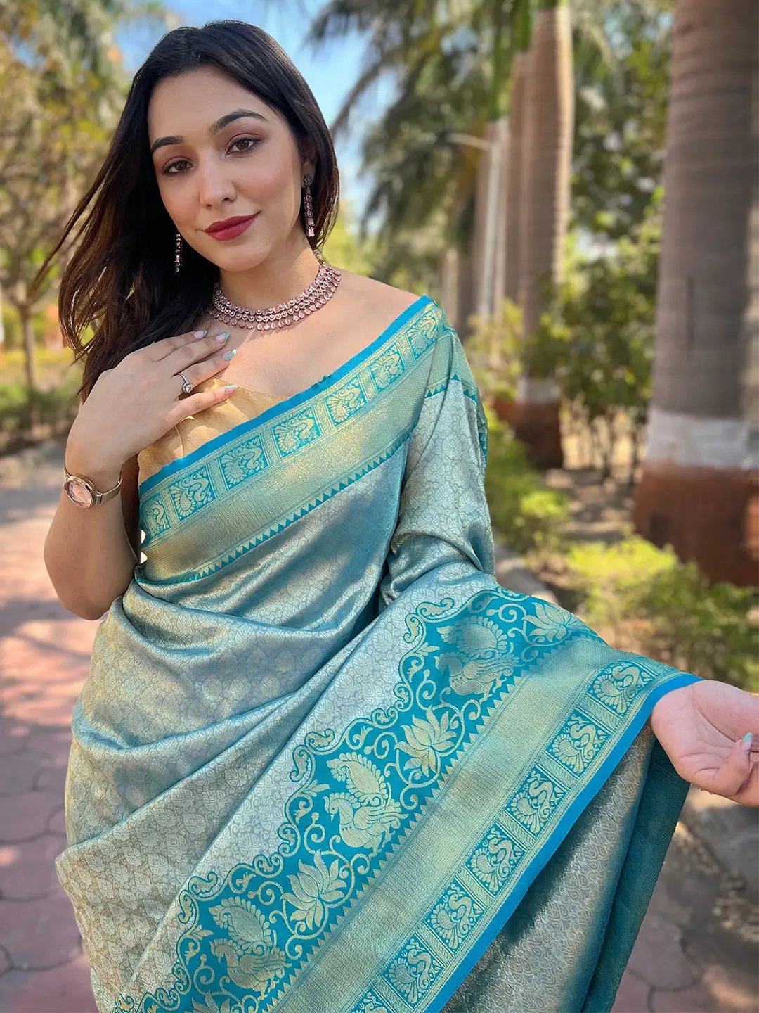 Close-up of woman in gold tissue Kanjivaram silk saree