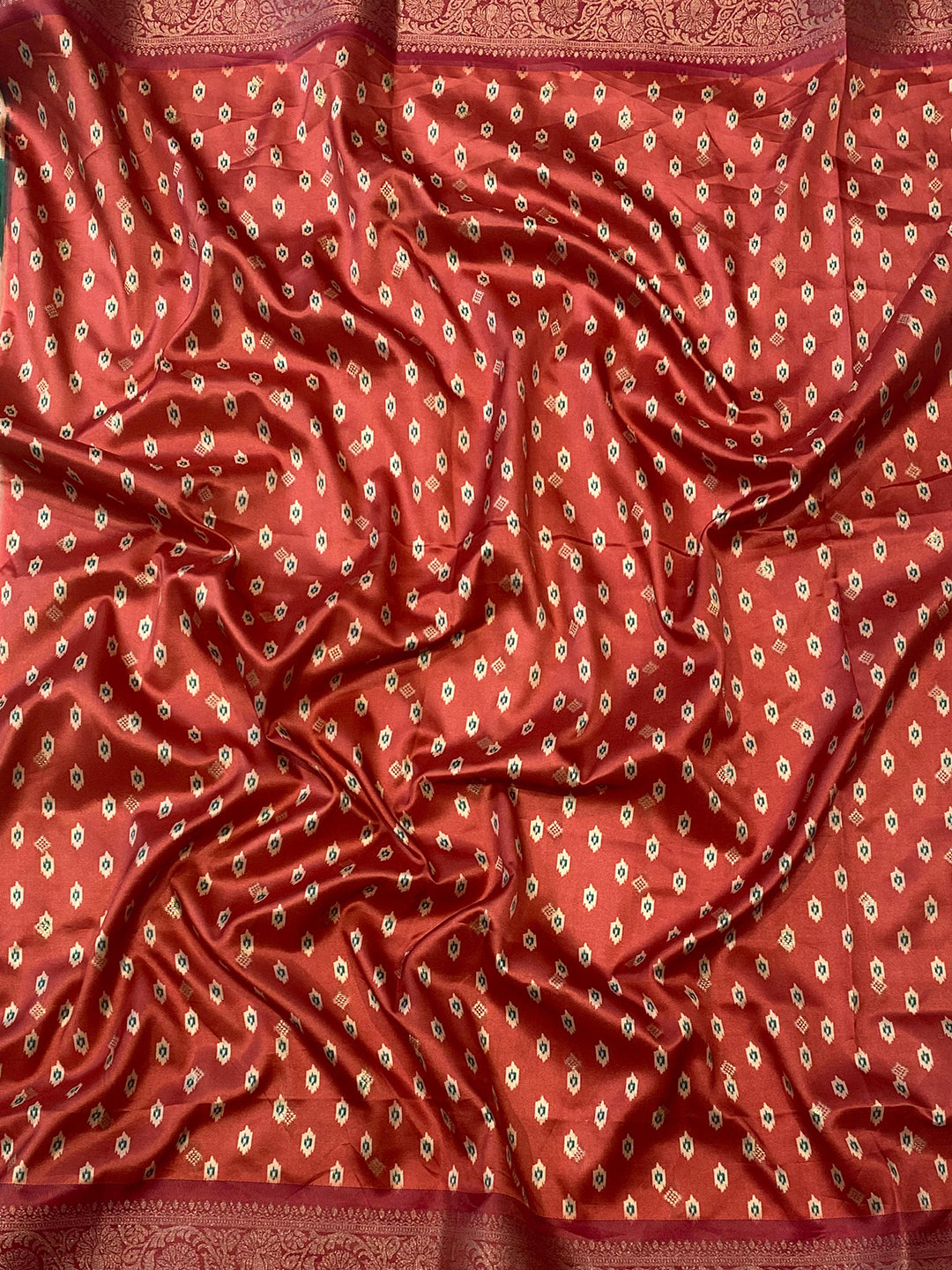 Close-up of red Zari Patola pallu on Banarasi soft silk saree