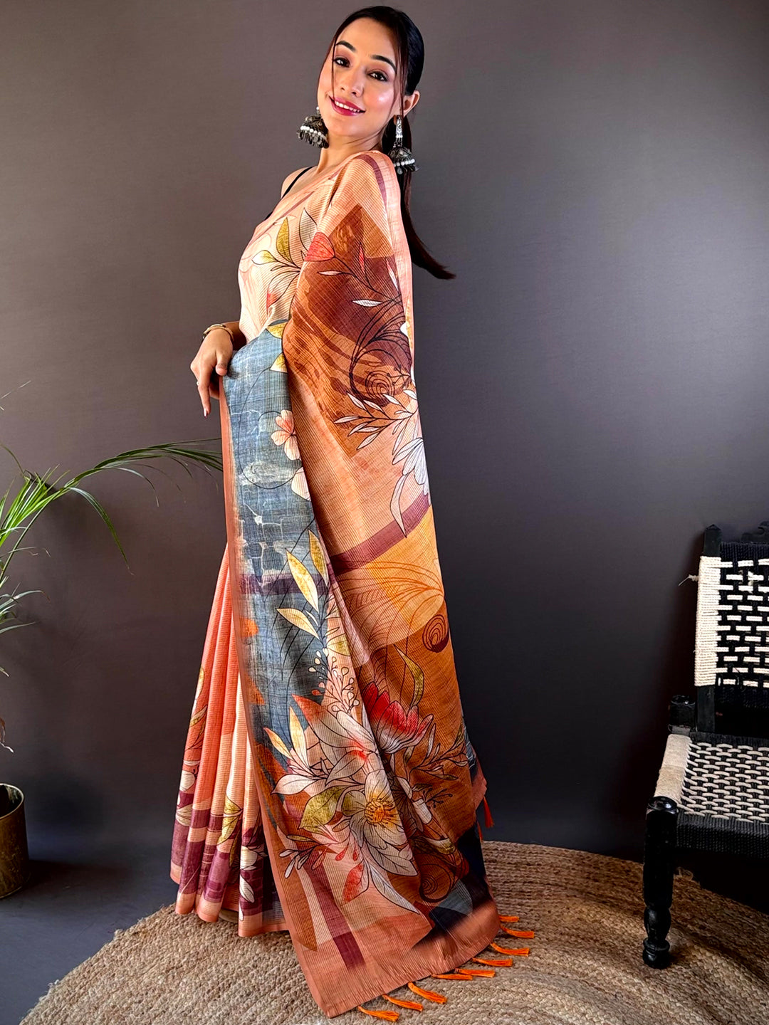 Side pose of Light Orange Semi Zari Tussar Floral Saree