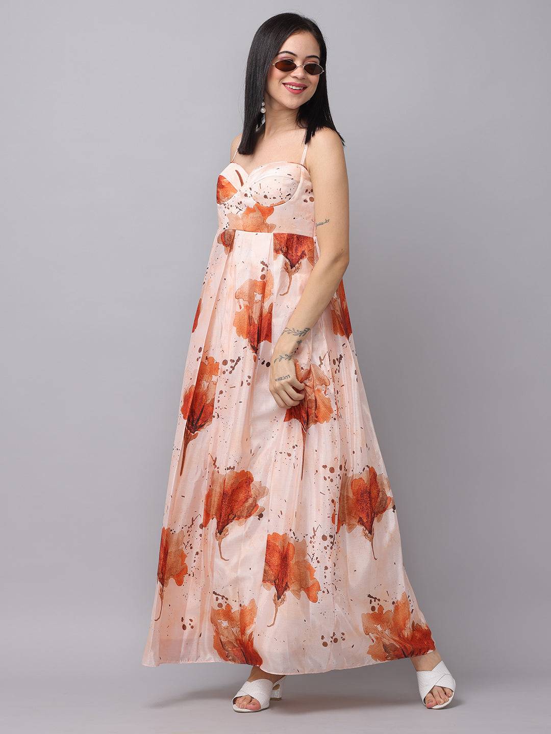 Side view of peach color corset dress with floral design.