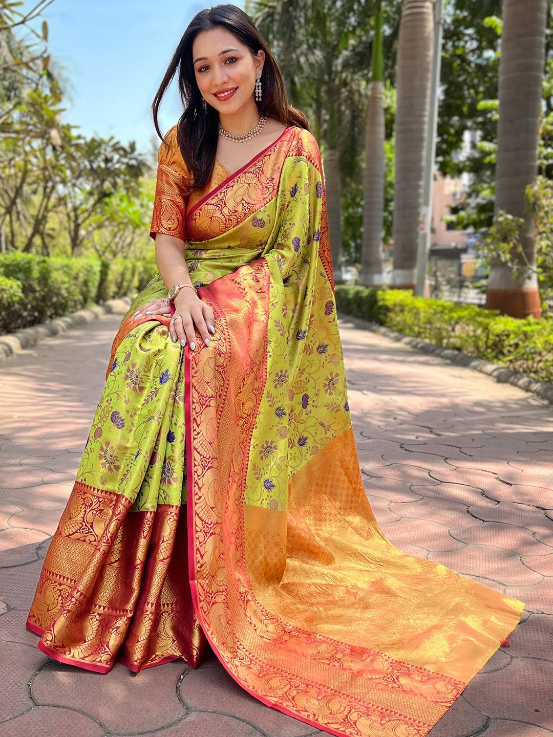 Elegant light green Banarasi saree with zari butti details