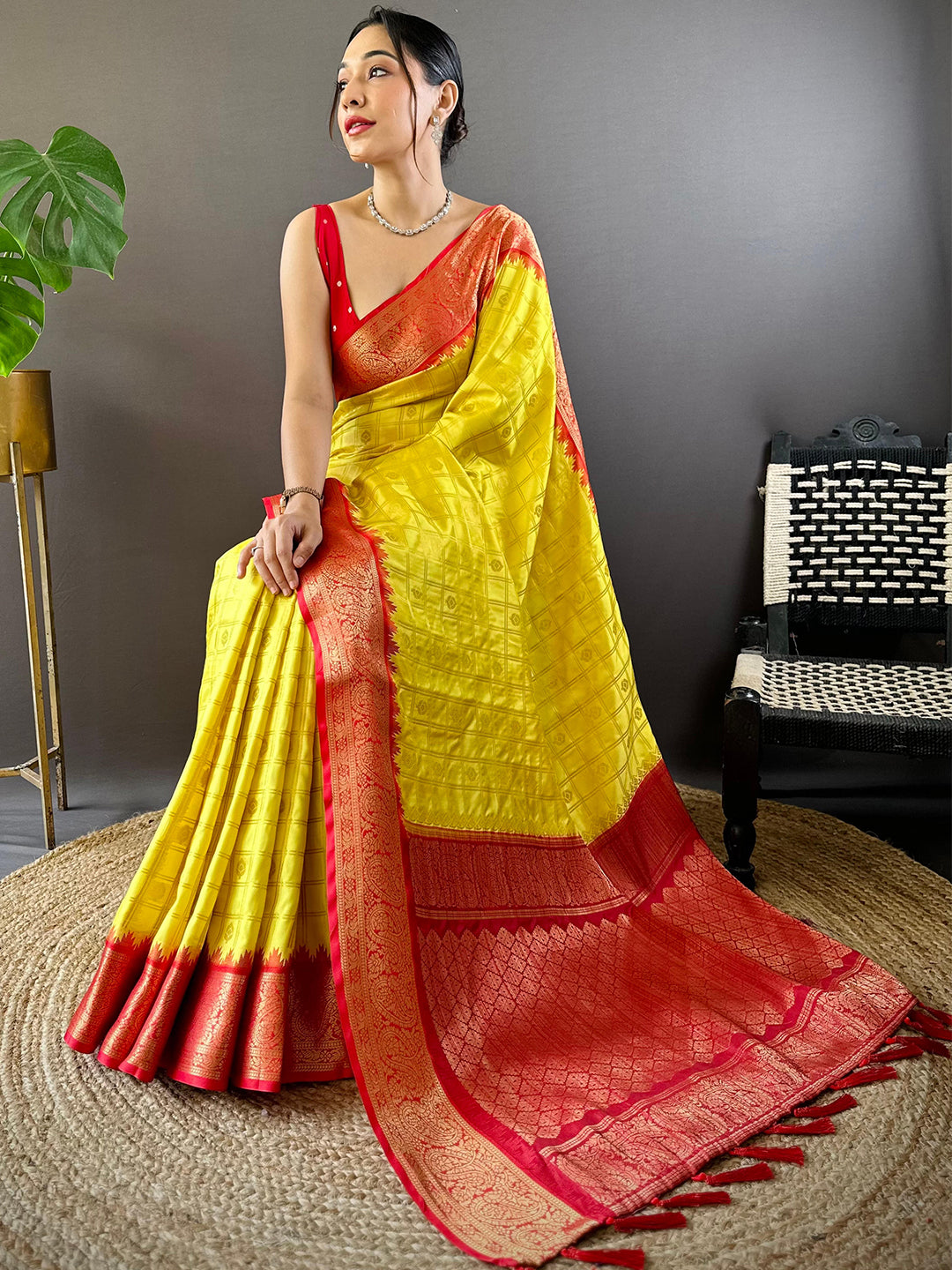 Seated model in Sunshine Yellow Kovai Banarasi Silk Saree