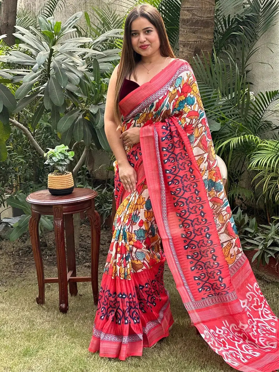 Stylish Floral Ikkat Saree showcased in lush garden