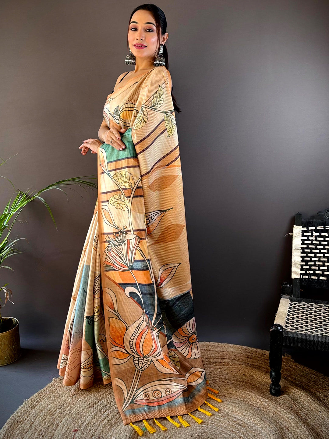 Peach Zari Tussar saree with vibrant floral motifs, side pose