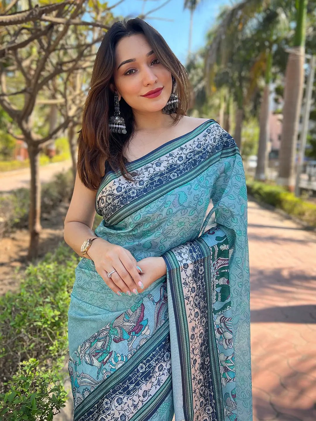 Model showcasing Satin Kota Doria Saree with intricate Kalamkari design.