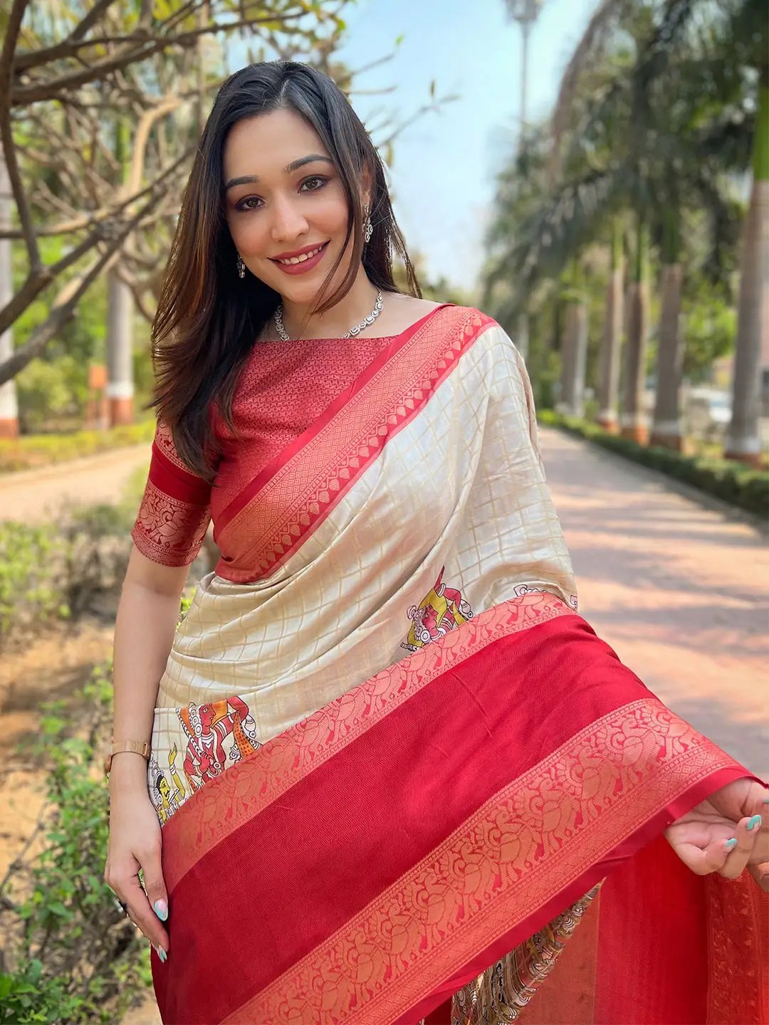 Detailed view of Banarasi saree with red and cream design