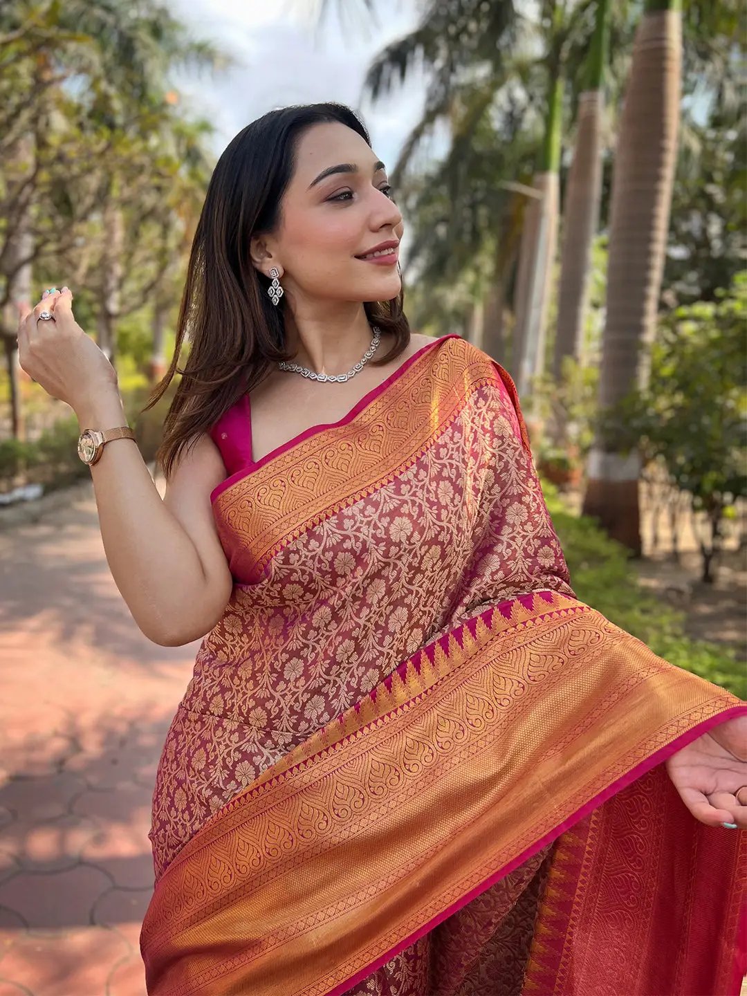 Close-up of pink gold tissue saree with intricate jacquard