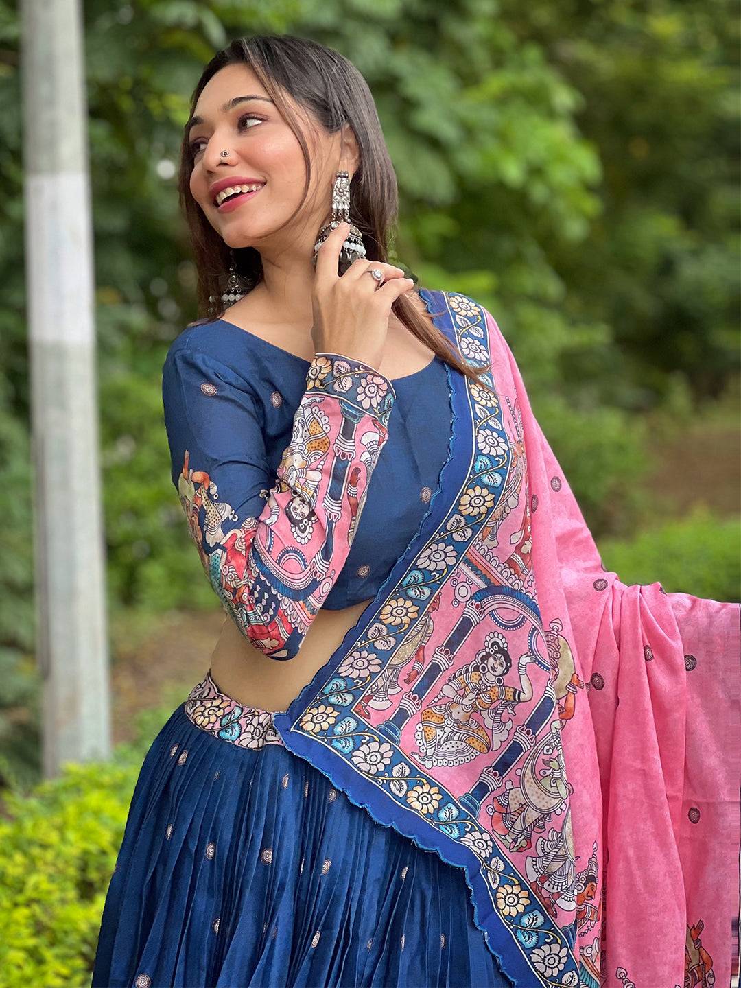 Smiling model in Admiral Blue Kalamkari Lehenga