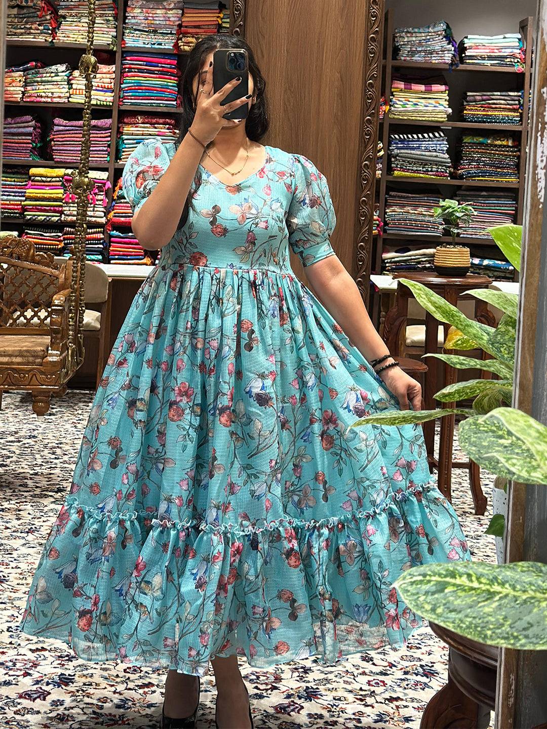 Powder blue floral print dress with puff sleeves and V-neckline.