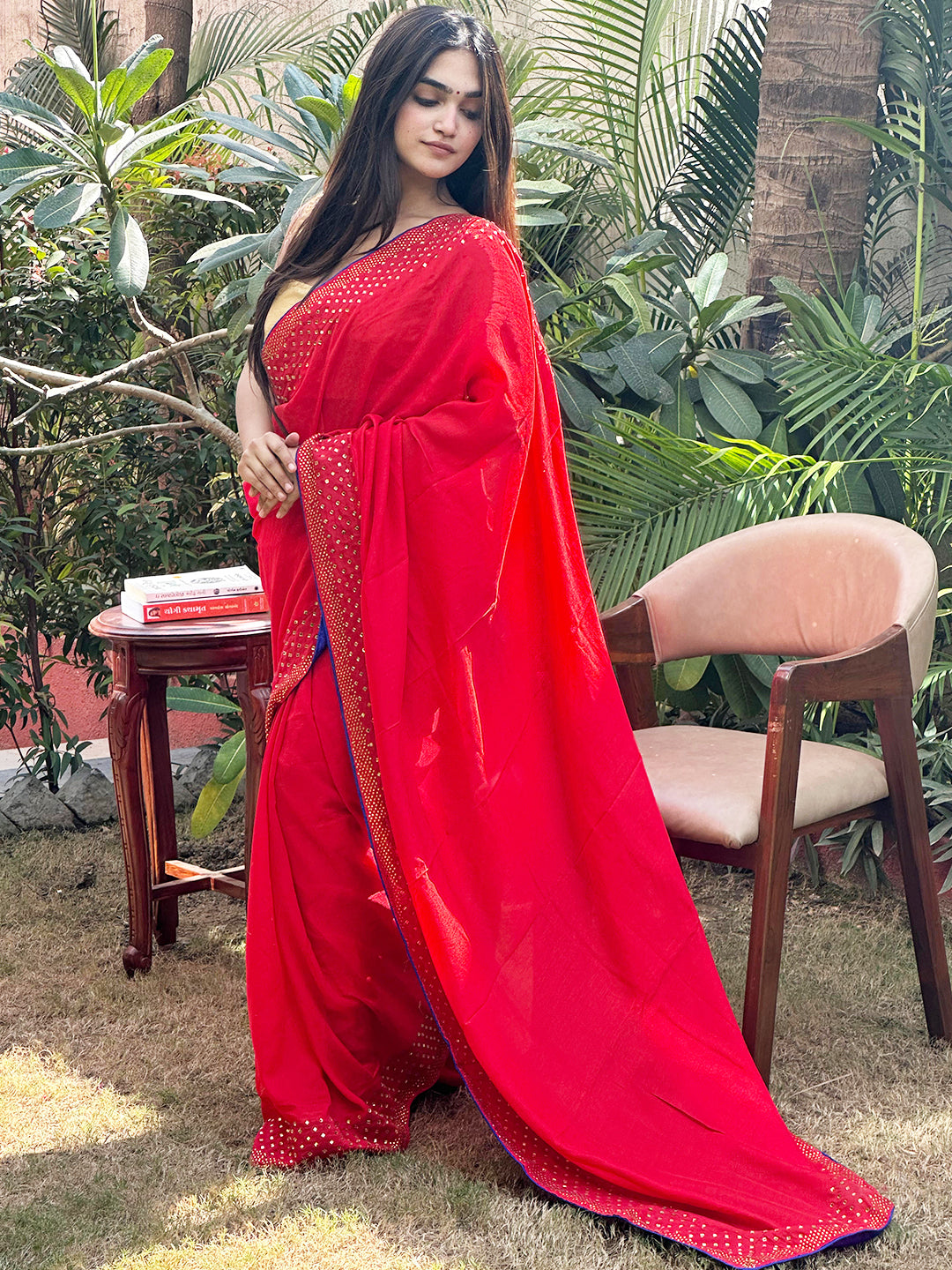 Model in red Vichitra silk saree with Swarovski stone work