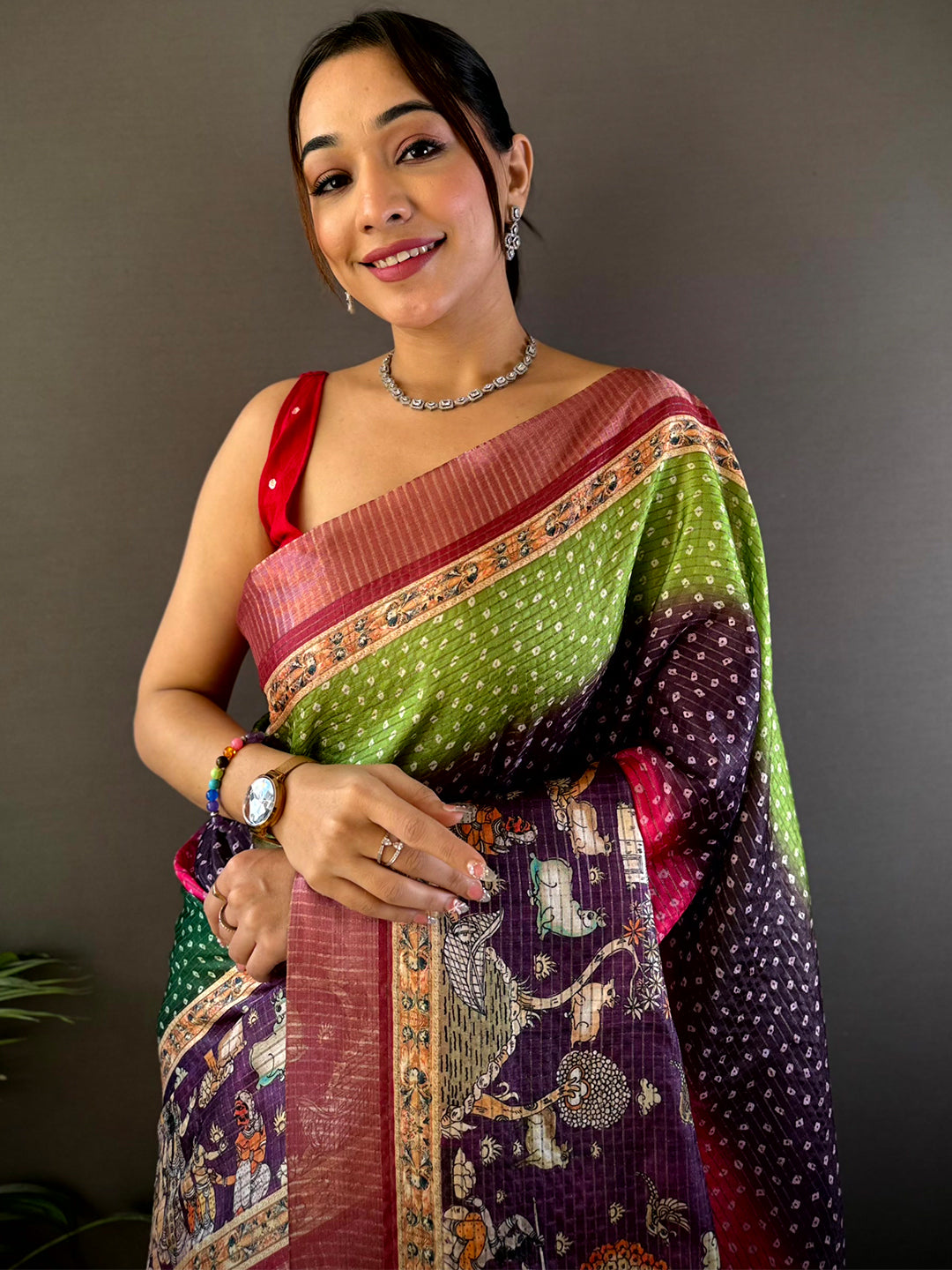 Vibrant Silk Blend Bandhani Print Saree featuring intricate patterns and rich hues of green, pink, and purple, perfect for festive and wedding occasions.