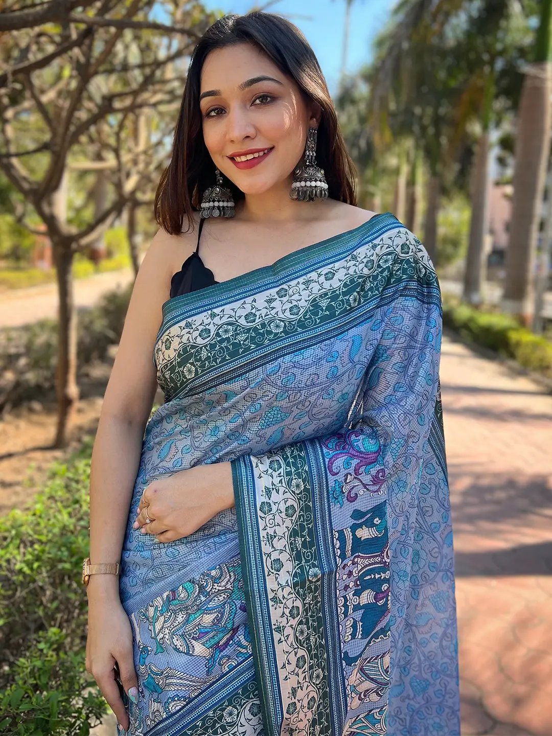 Model wearing Blue Satin Kota Doria Saree