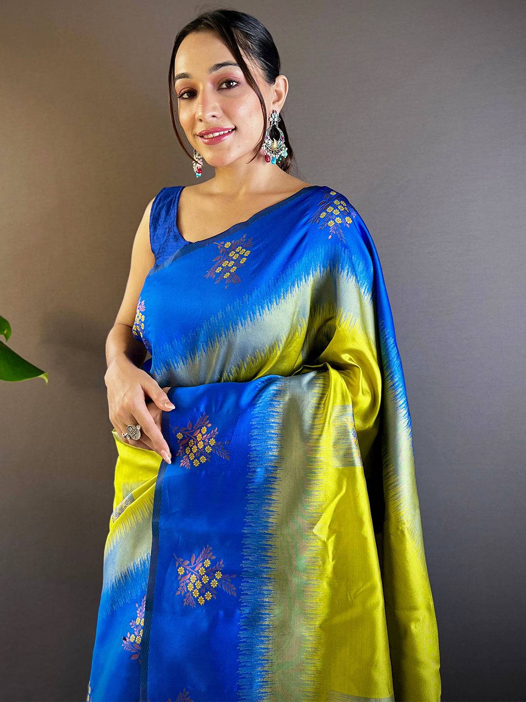 Model wearing blue and green Banarasi silk saree