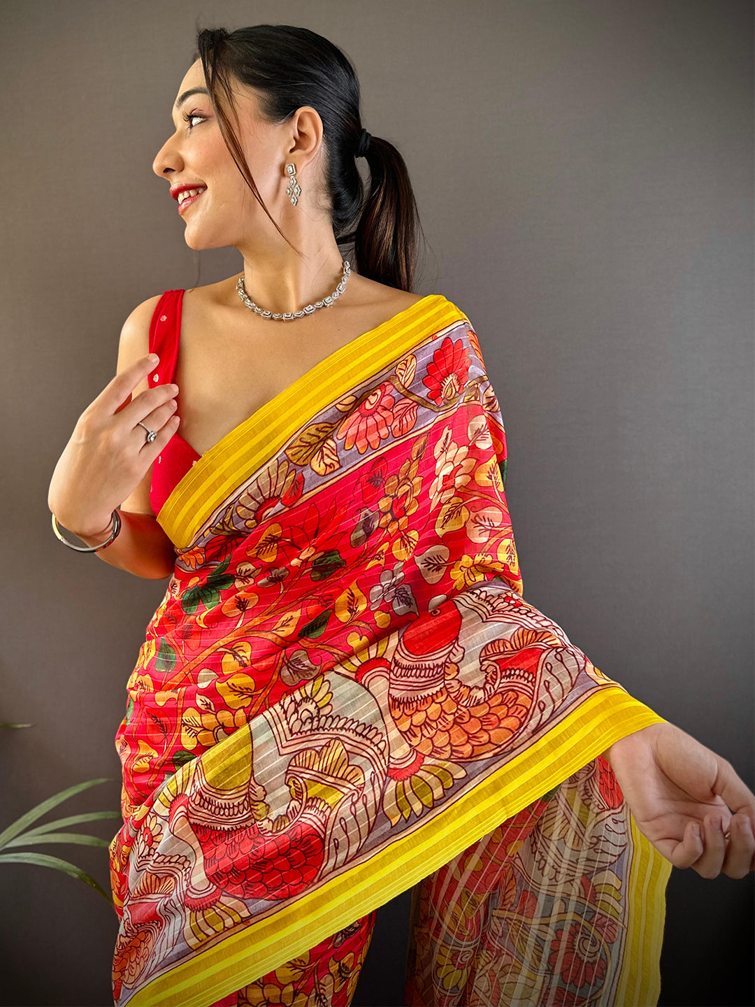 Model wearing Rose Red Pen Kalamkari Linen Saree