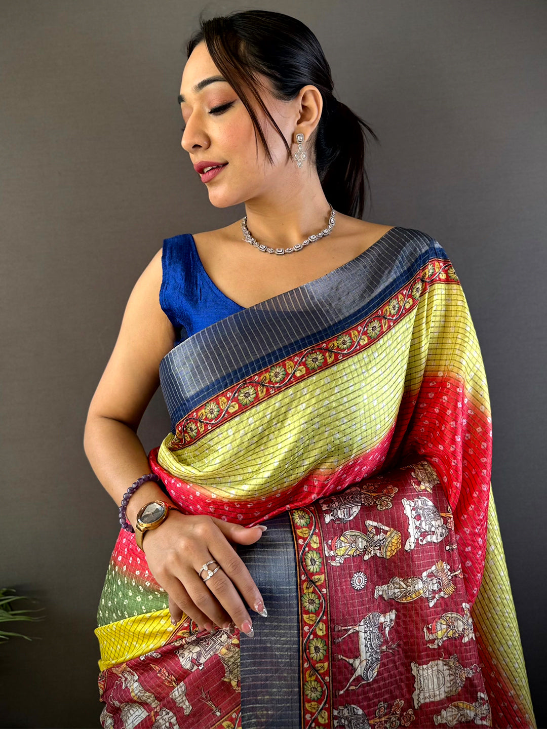 Graceful Silk Blend Bandhani Print Saree with vibrant hues and intricate patterns, draped elegantly. Perfect for festive and wedding occasions.