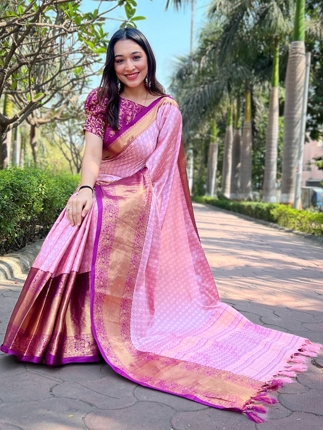 Luxurious pink Kanjivaram saree draped elegantly