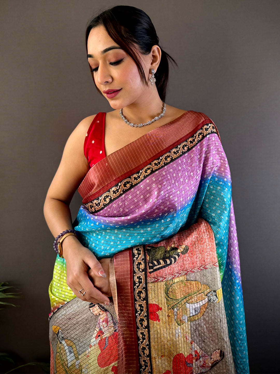 Radiance Silk Blend Bandhani Print Saree featuring vibrant hues, intricate patterns, and traditional artwork. A perfect choice for festive and wedding wear.