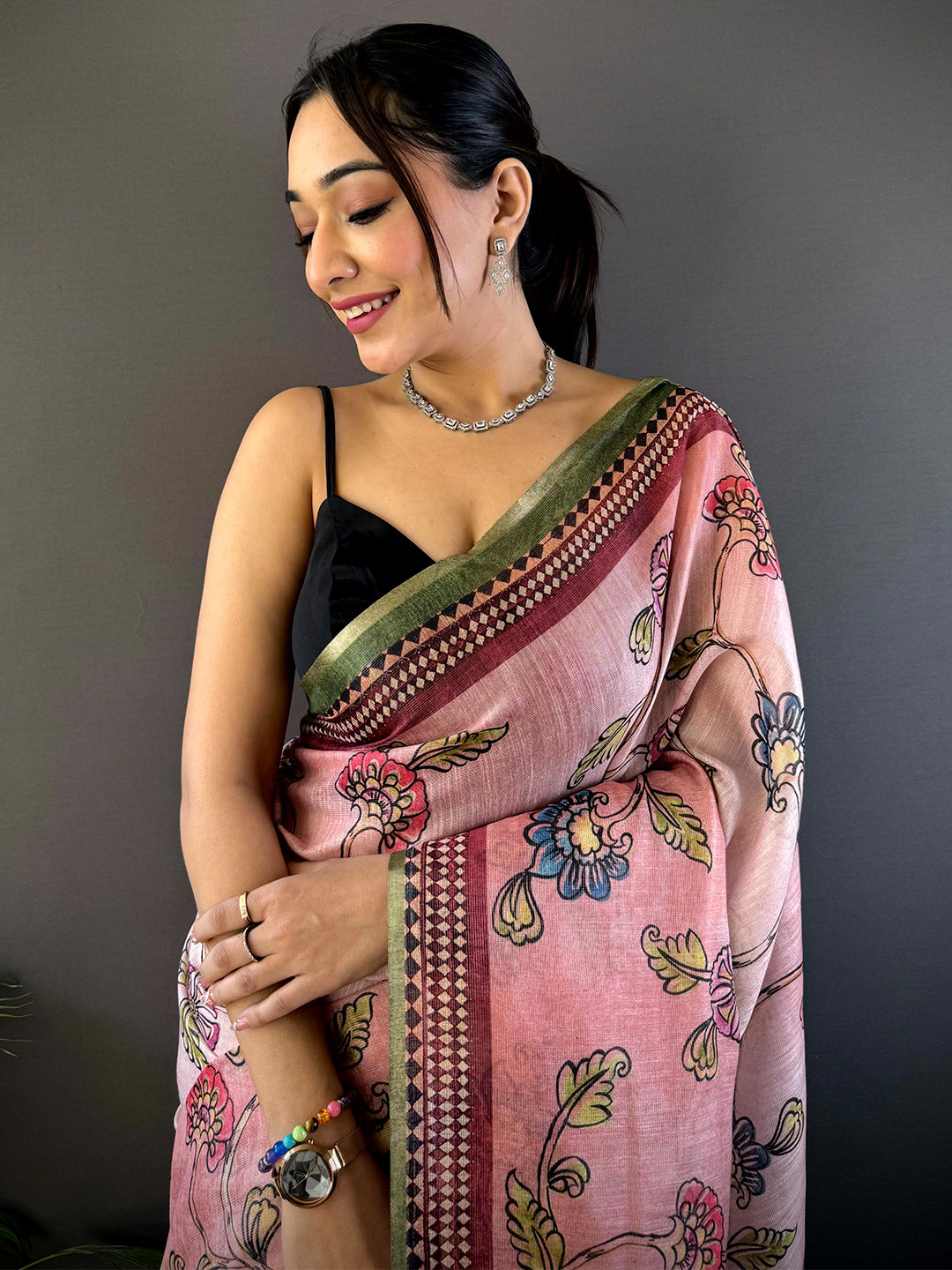 Rose Pink Zari Tussar Floral Saree with intricate floral prints and zari detailing, draped elegantly. Perfect for festive and wedding occasions.