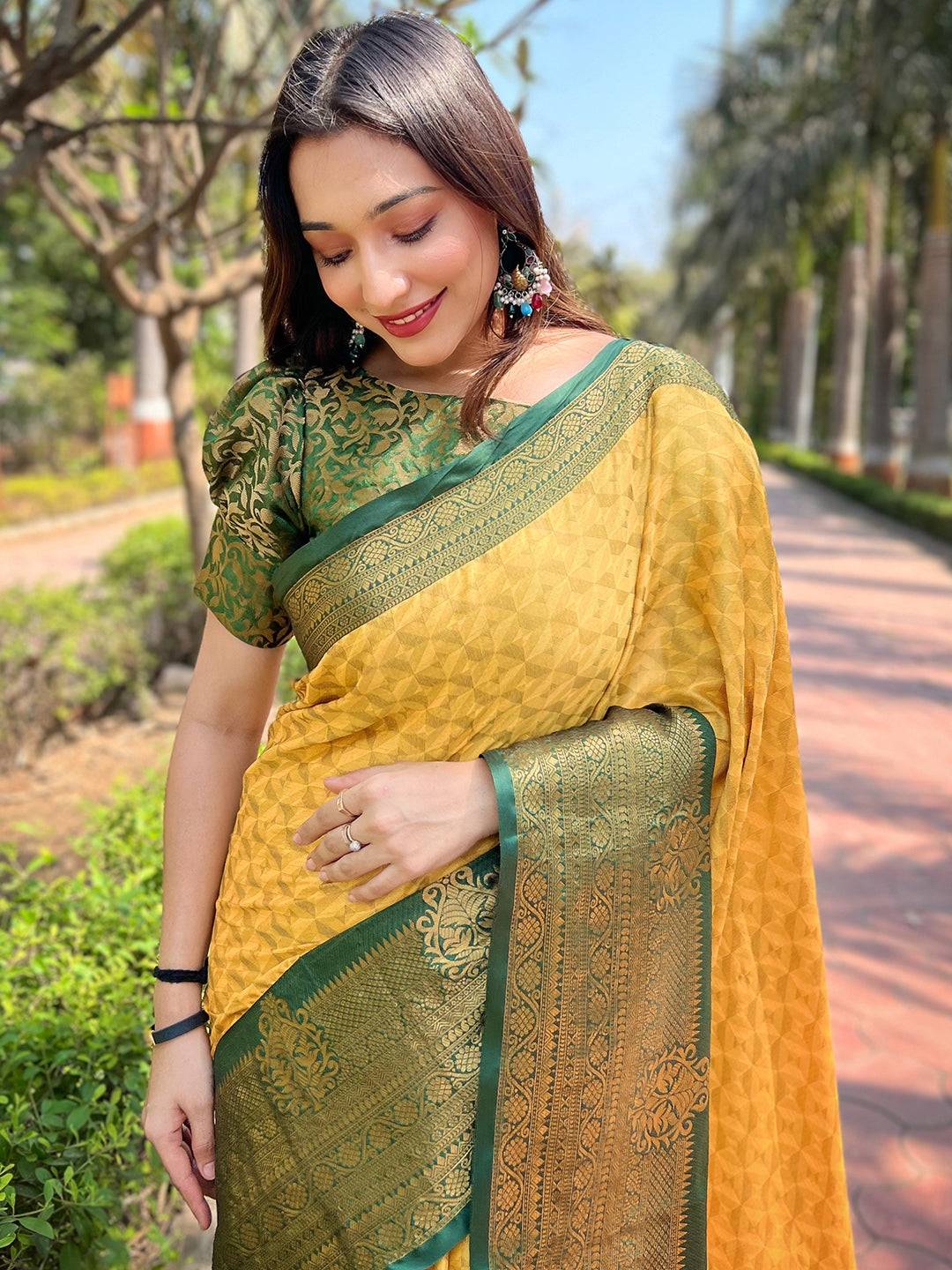 Woman in yellow Kanjivaram silk saree with green blouse