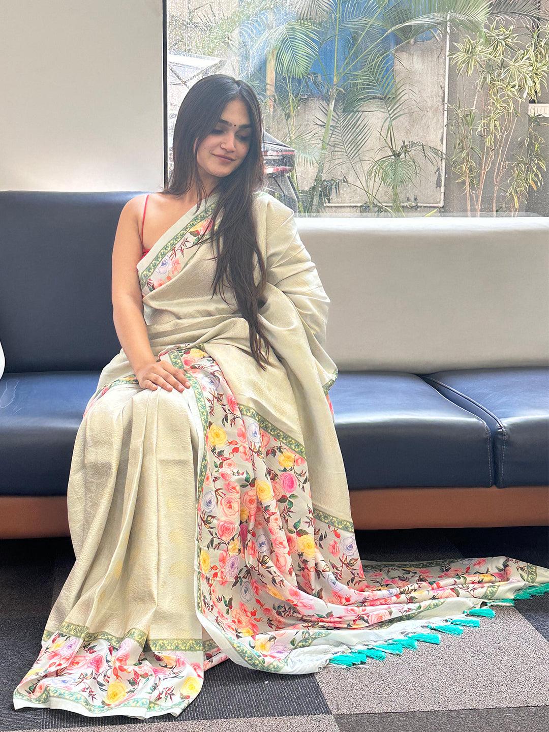 Floral print Kanjivaram saree draped elegantly on a woman.