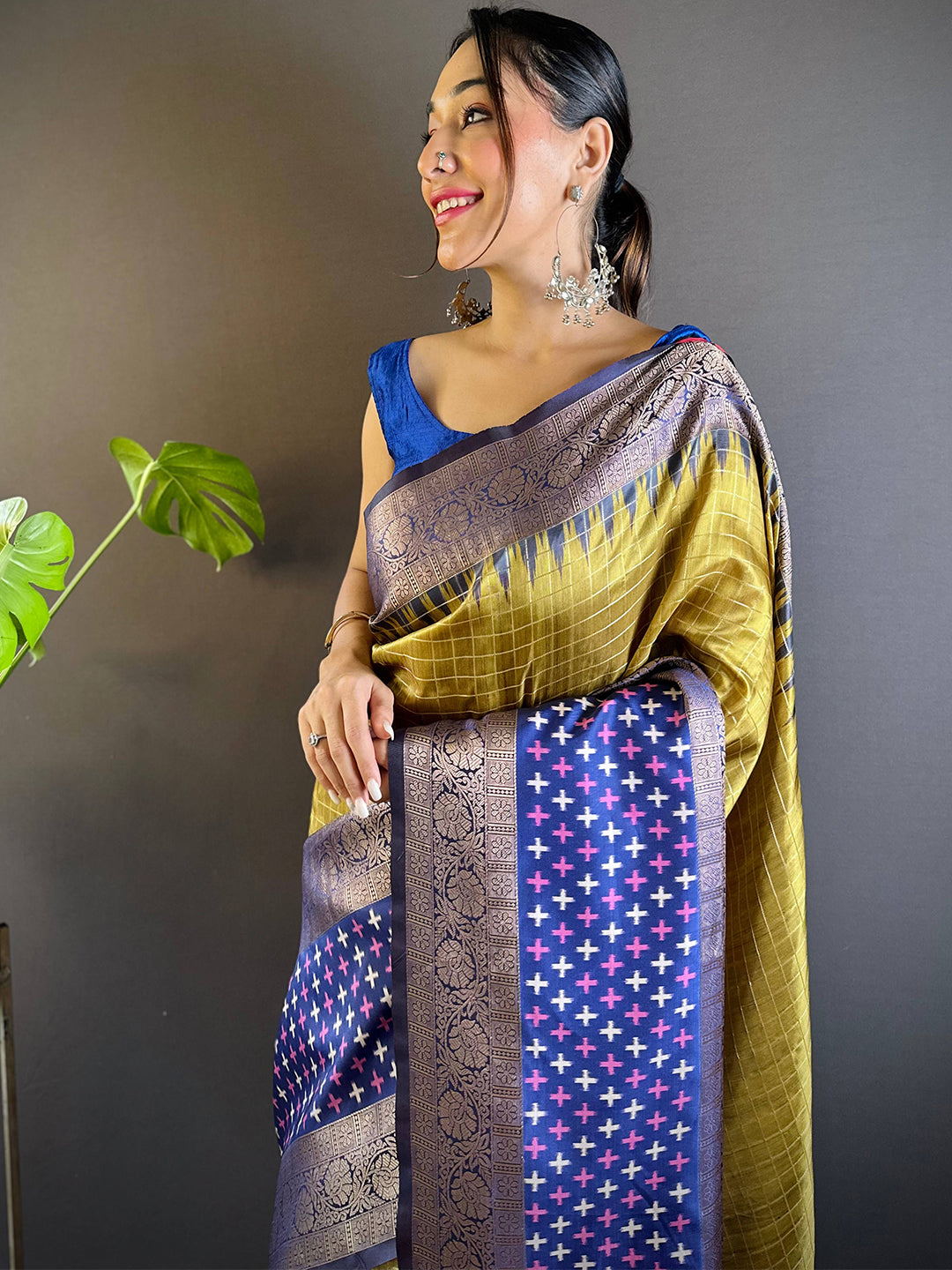 Model wearing Green Chex Ikkat Saree with Double Border